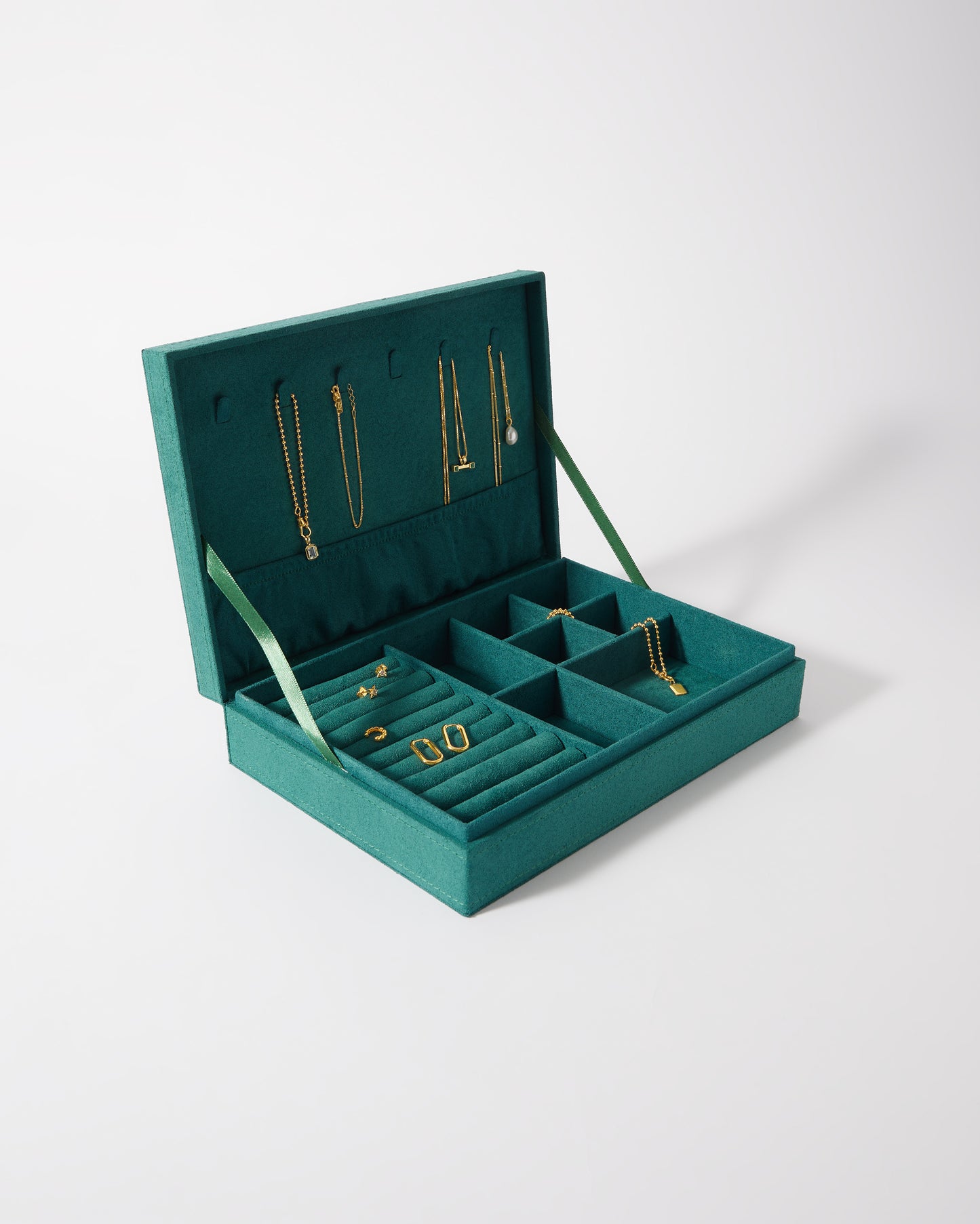 Open teal Edge of Ember Jewellery Box displaying multiple compartments with solid 14ct gold fine jewellery including gold chains, earrings, and rings, crafted from recycled metals with ethical sourcing.