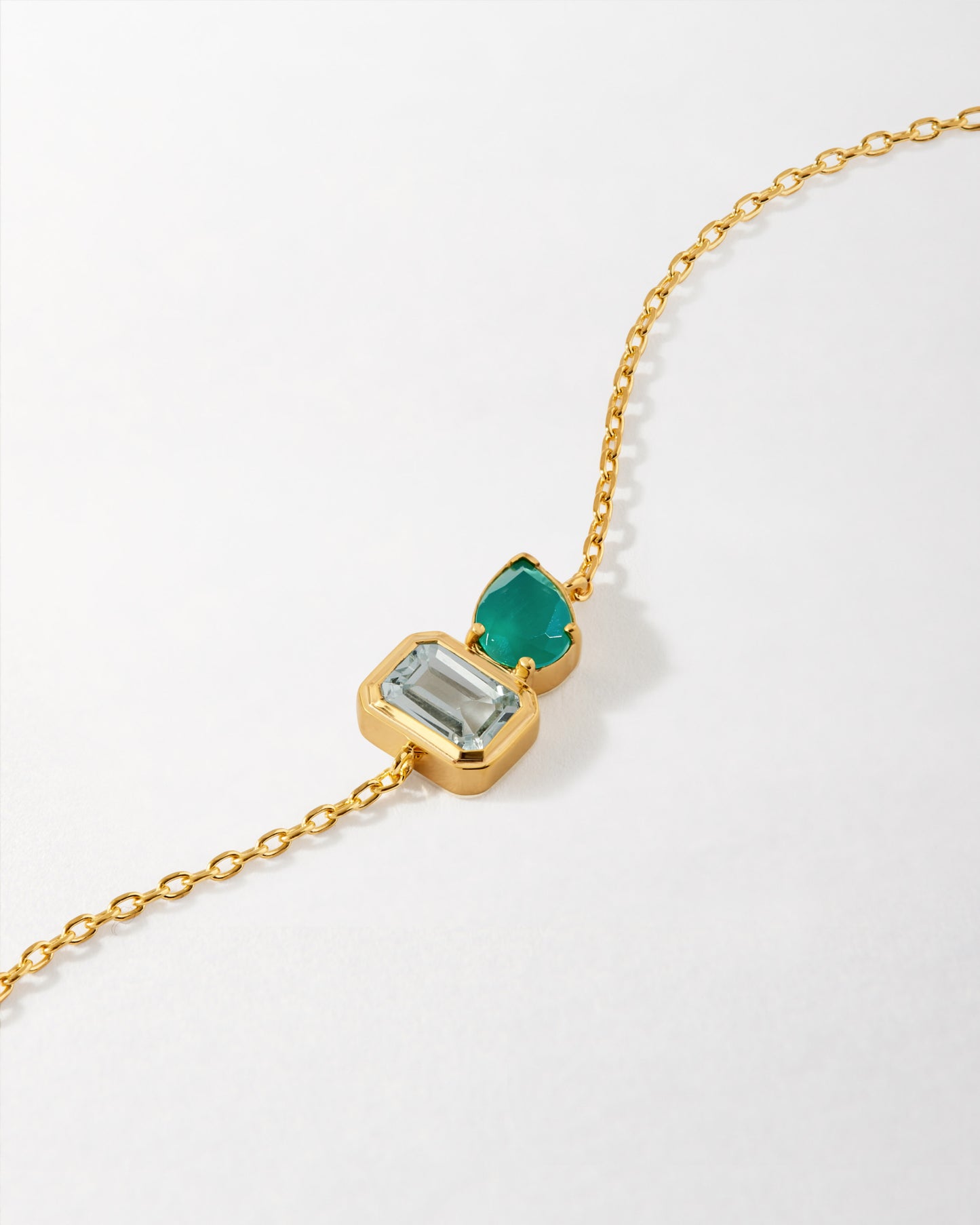 Delicate Toi Et Moi Strength Bracelet featuring gold-plated sterling silver with two differently shaped gemstones, crafted from recycled metals with ethical sourcing.