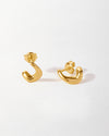 Charlotte Collins Twist Stud Earrings in gold-plated sterling silver, featuring a modern twisted stud design perfect for adding a subtle yet stylish touch to any outfit.