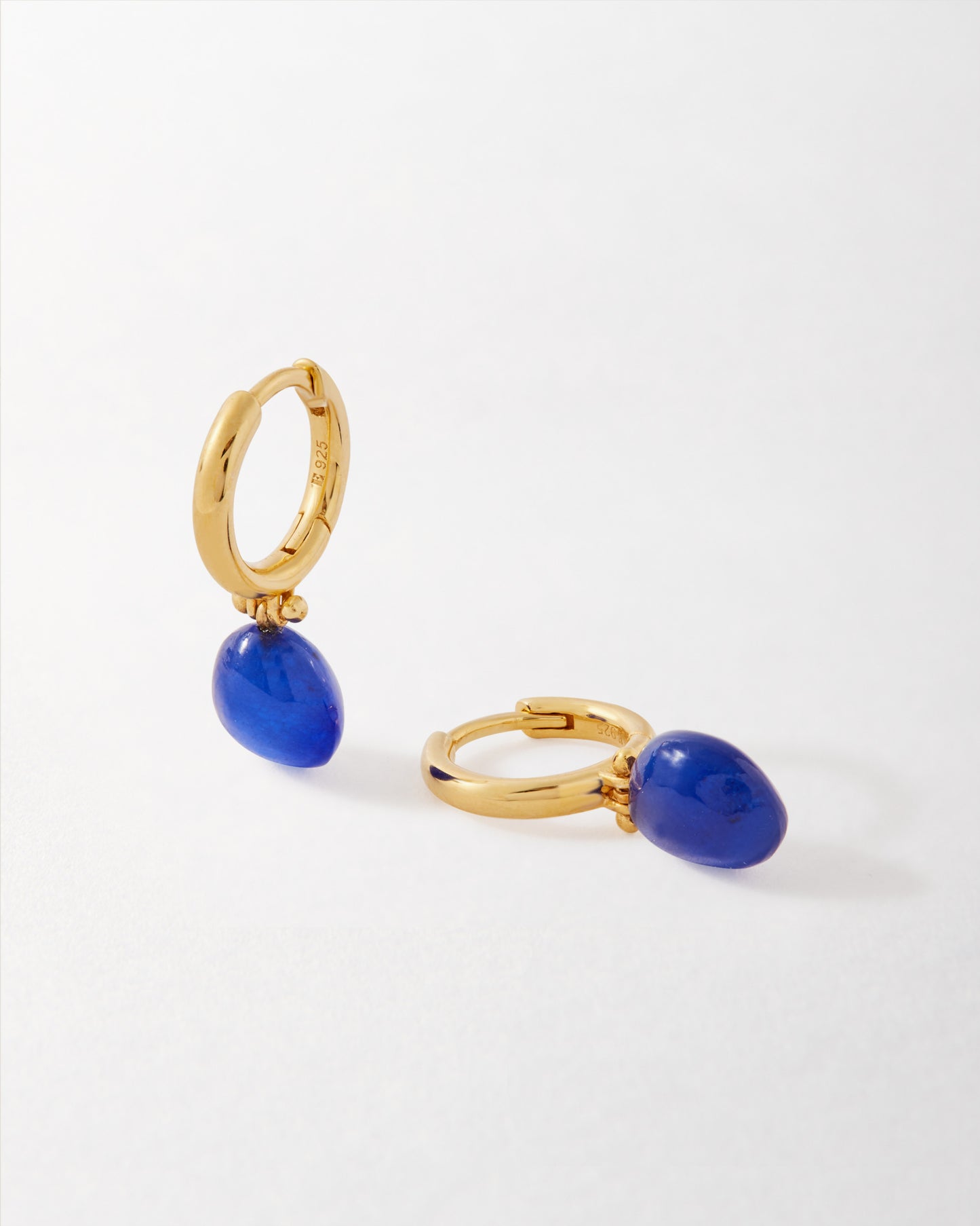 Coastal Blue Quartz Earrings featuring gold-plated sterling silver hoop design with vibrant blue quartz drops, crafted with recycled metals for fine everyday jewellery.