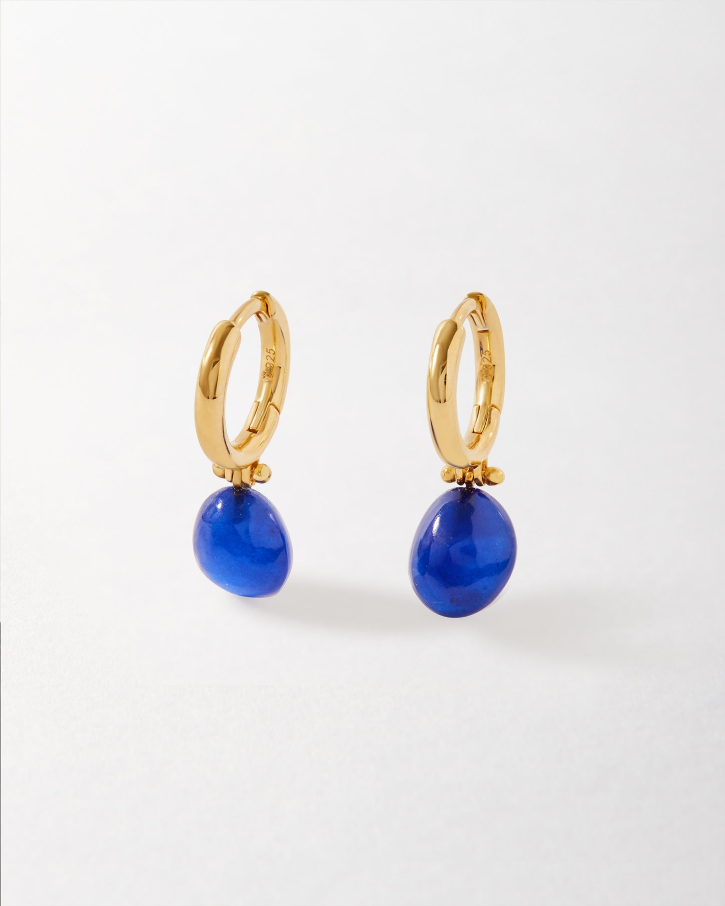 Coastal Blue Quartz Earrings featuring gold-plated hoop design with vibrant blue quartz drops, crafted using recycled metals for fine, considered jewellery made to last.