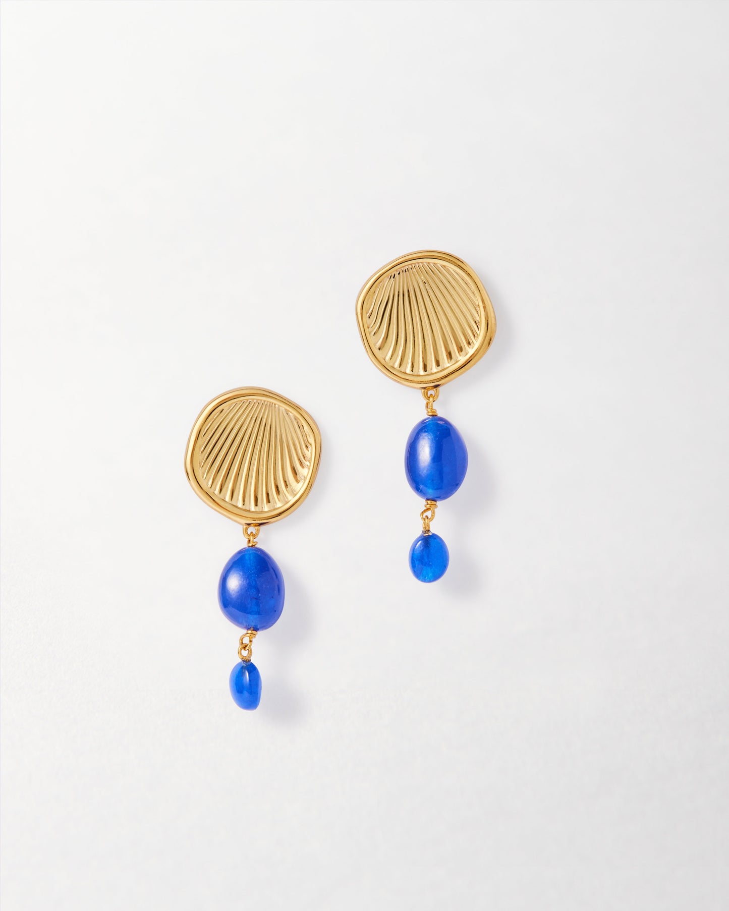 Coastal Blue Quartz Statement Earrings featuring gold-plated sterling silver stud design with vibrant blue quartz drops, crafted from recycled metals for considered, lasting fine jewellery.