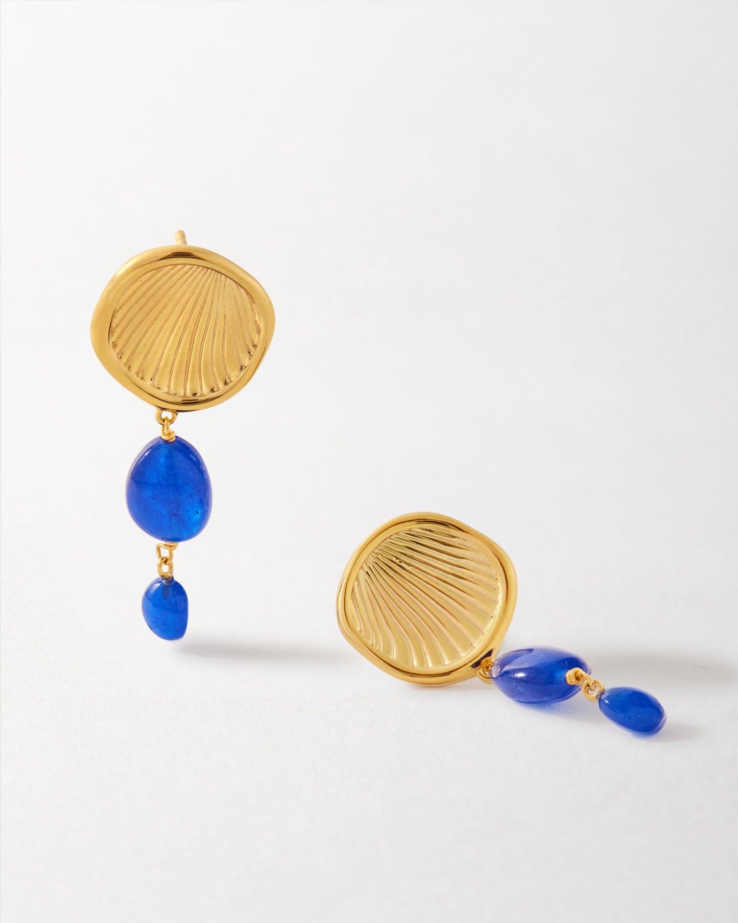 Coastal Blue Quartz Statement Earrings featuring gold-plated sterling silver studs with vibrant blue quartz stones, crafted from recycled metals for ethical fine jewellery.