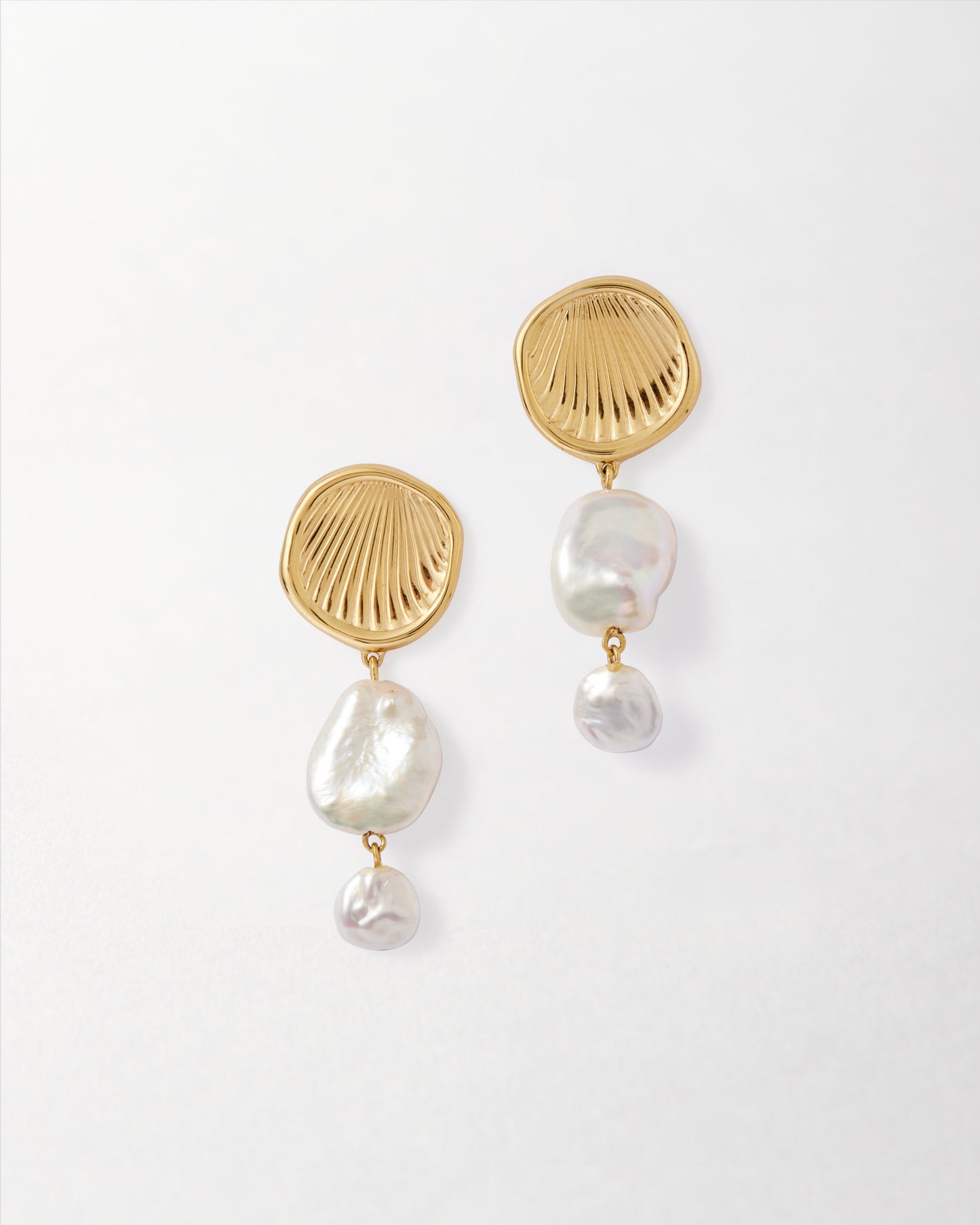 Coastal Pearl Statement Earrings featuring gold-plated stud design with two irregular white pearls, crafted from recycled metals for ethical, fine jewellery made to last.