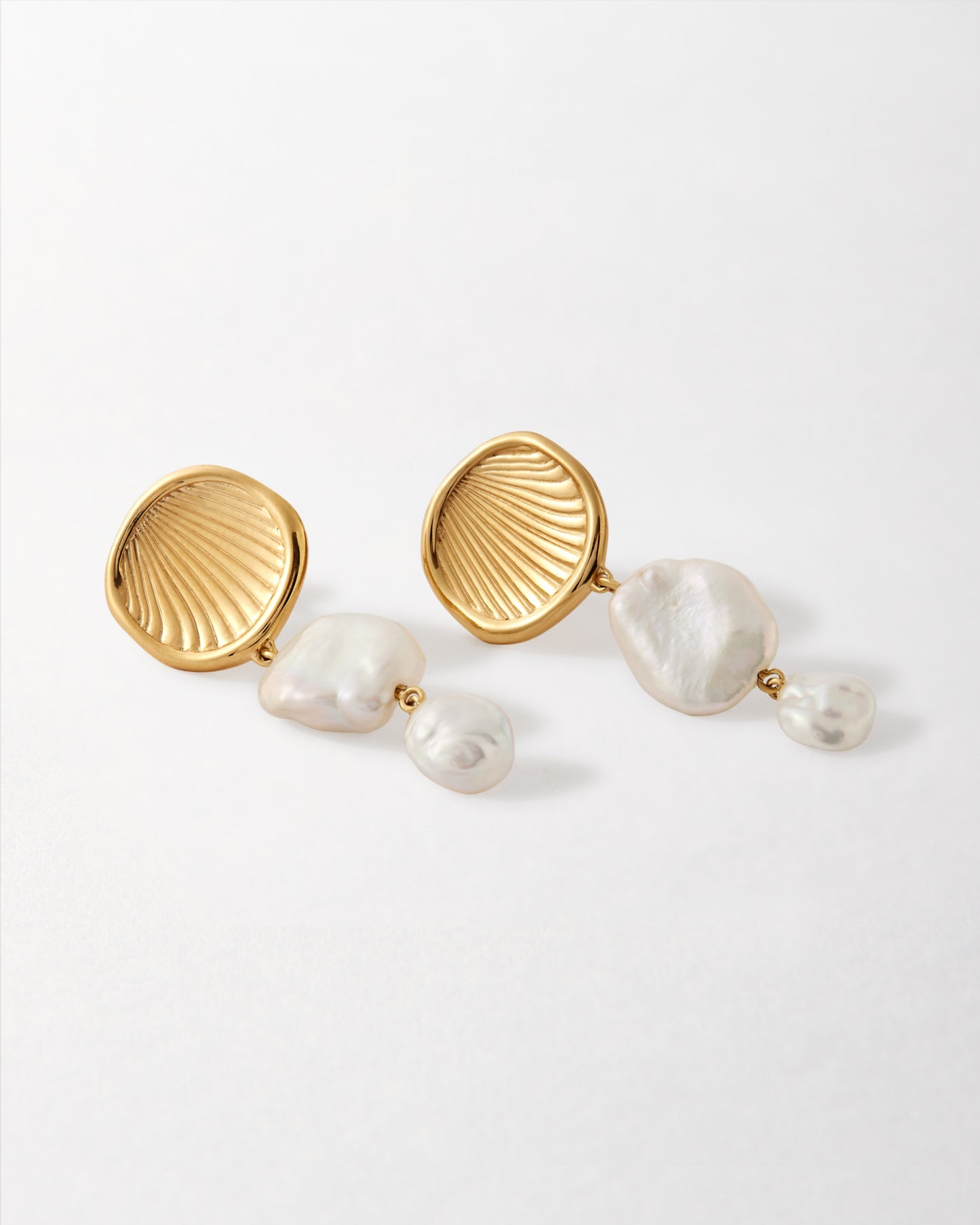 Coastal Pearl Statement Earrings featuring gold-plated stud design with irregular freshwater pearls, crafted from sterling silver and recycled metals for fine, ethical jewellery lovers.