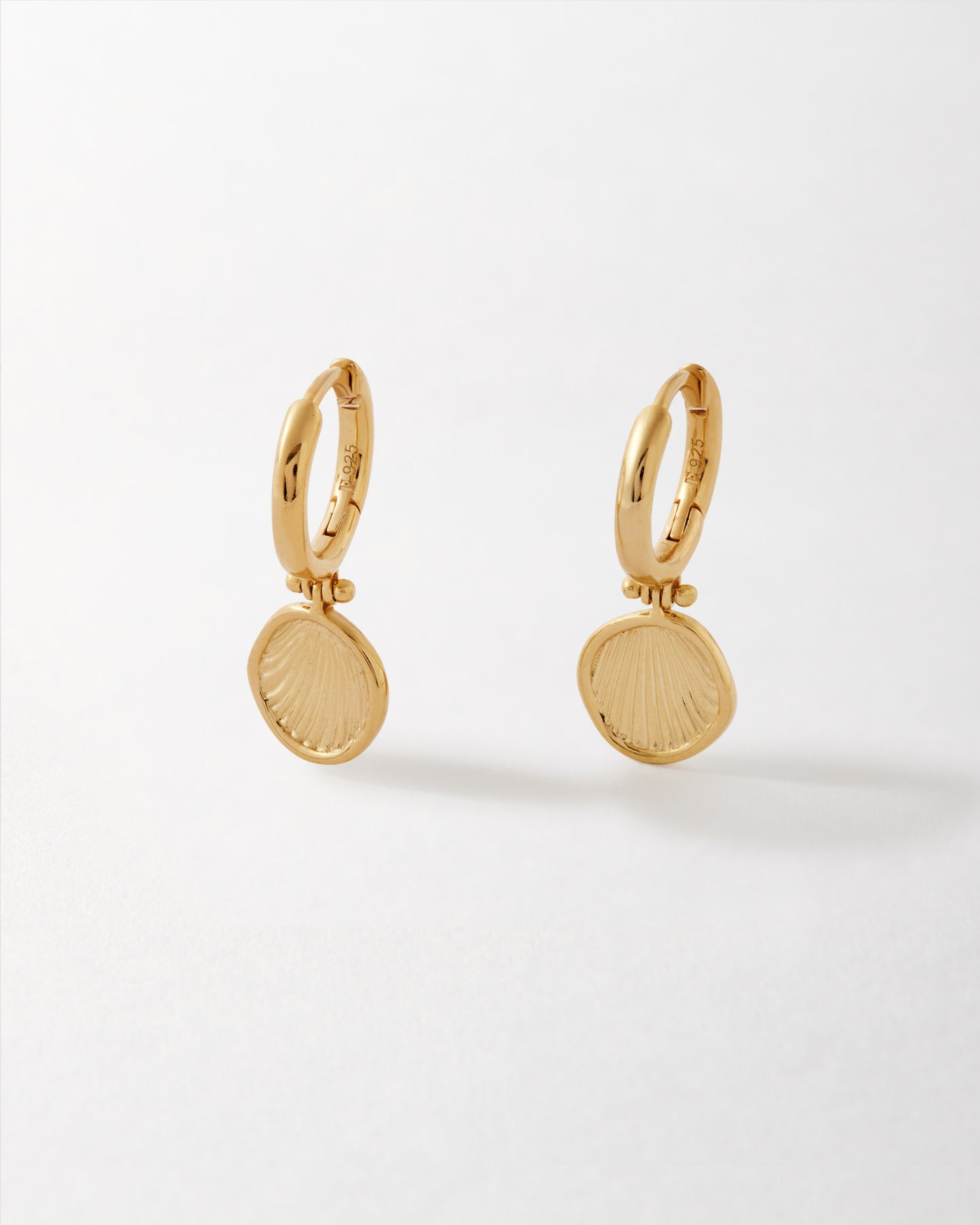 Delicate Coastal Shell Earrings crafted in gold-plated sterling silver, showcasing sustainable design with recycled metals and fine jewellery quality made to last.