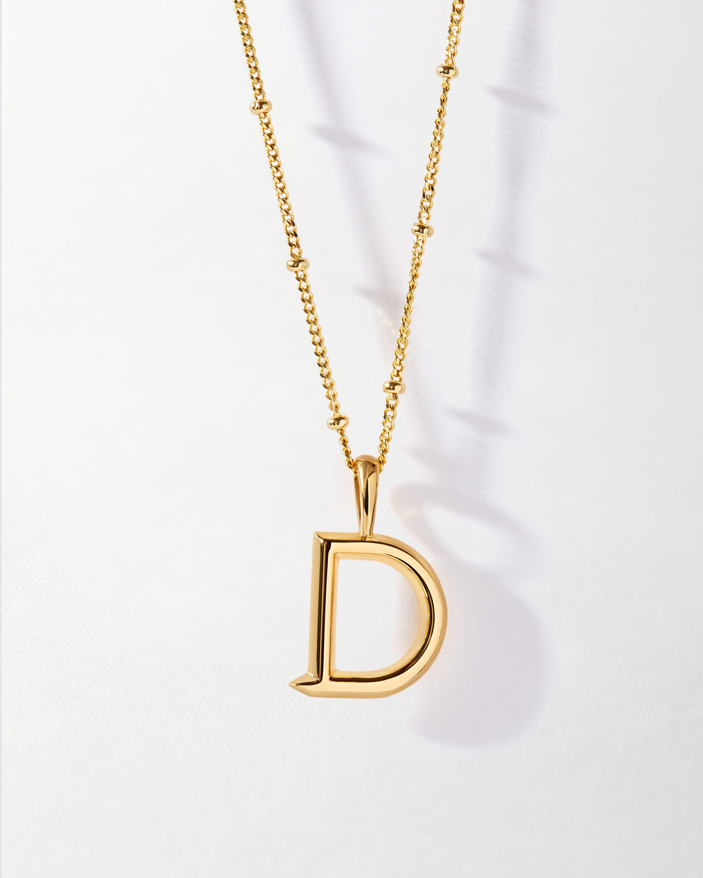 D' Initial Necklace - Gold featuring a gold-plated pendant on a delicate chain, crafted sustainably with recycled metals for fine jewellery you can wear every day.