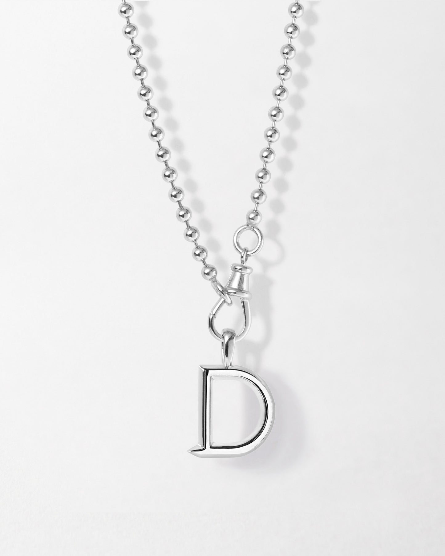 Initial Globe Necklace - Silver featuring a sterling silver pendant in the shape of a letter D on a delicate ball chain, crafted from recycled metals for considered jewellery built to last.