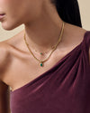 Pebble Green Onyx Necklace featuring a gold-plated pendant with a vibrant green onyx stone, styled alongside a delicate gold chain, crafted from recycled metals with ethical sourcing.