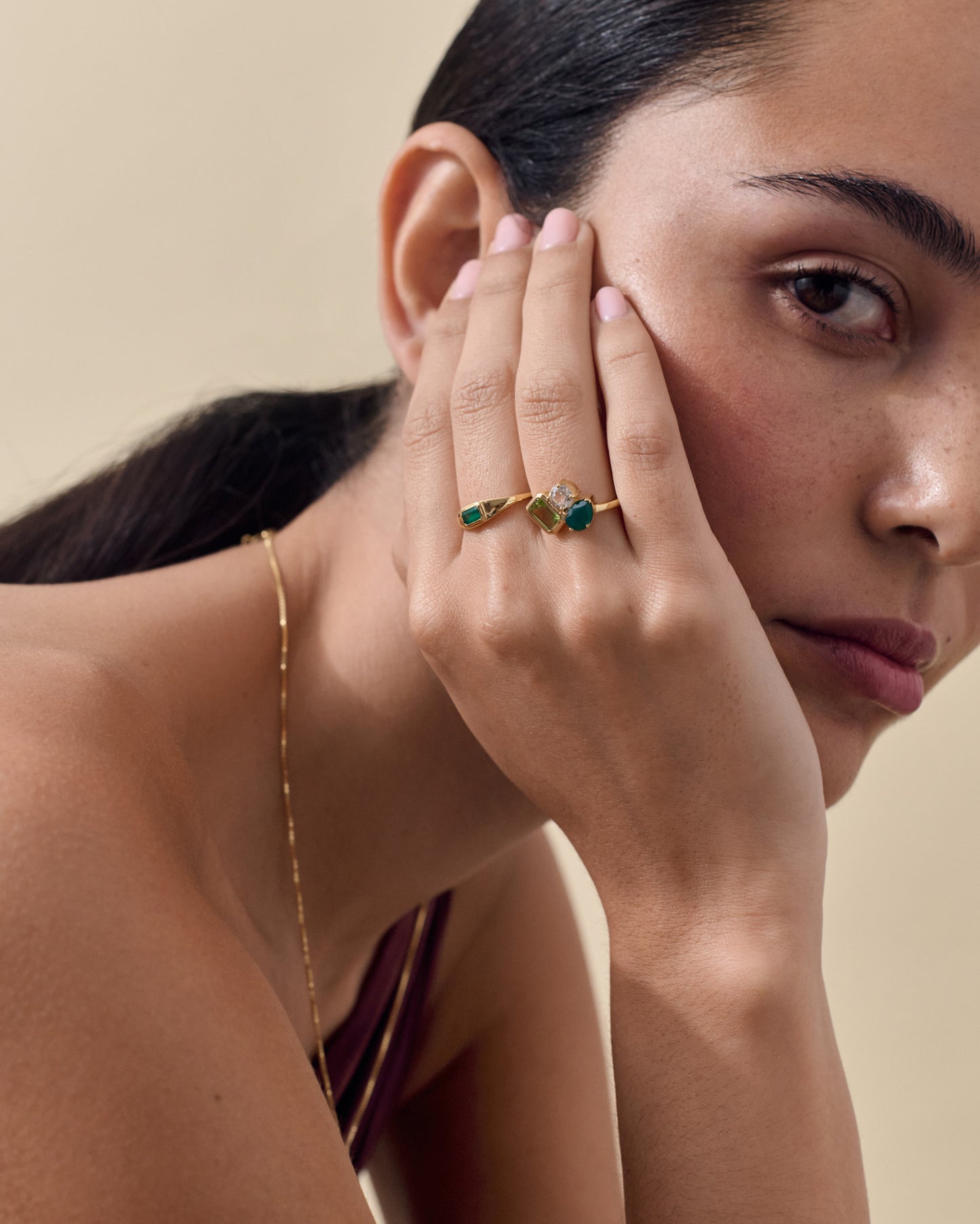 Close-up of a woman wearing the Pebble Green Onyx Ring crafted from gold-plated and sterling silver, showcasing sustainable, considered jewellery made from recycled metals and ethical sourcing.