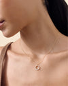 Close-up of a woman wearing a Diamond Halo Necklace made from solid 14ct gold featuring a delicate pendant with ethically sourced lab-grown diamonds on a fine gold chain, showcasing considered jewellery crafted from recycled metals and built to last.