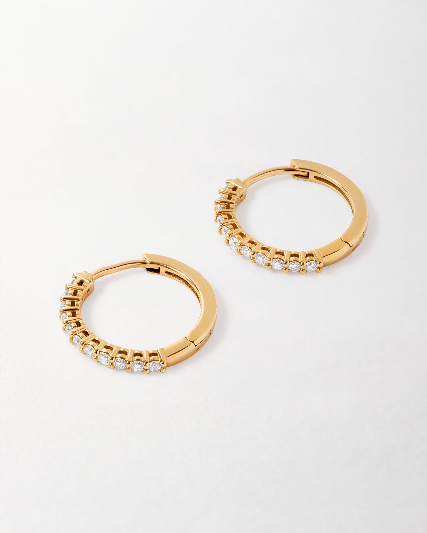 Medium Diamond Halo Hoop Earrings crafted in solid 14ct gold with ethically sourced lab-grown diamonds, featuring a timeless hoop design made from recycled metals. Considered jewellery. Solid gold. Fine jewellery for the everyday. Made in recycled metals. Built to last.