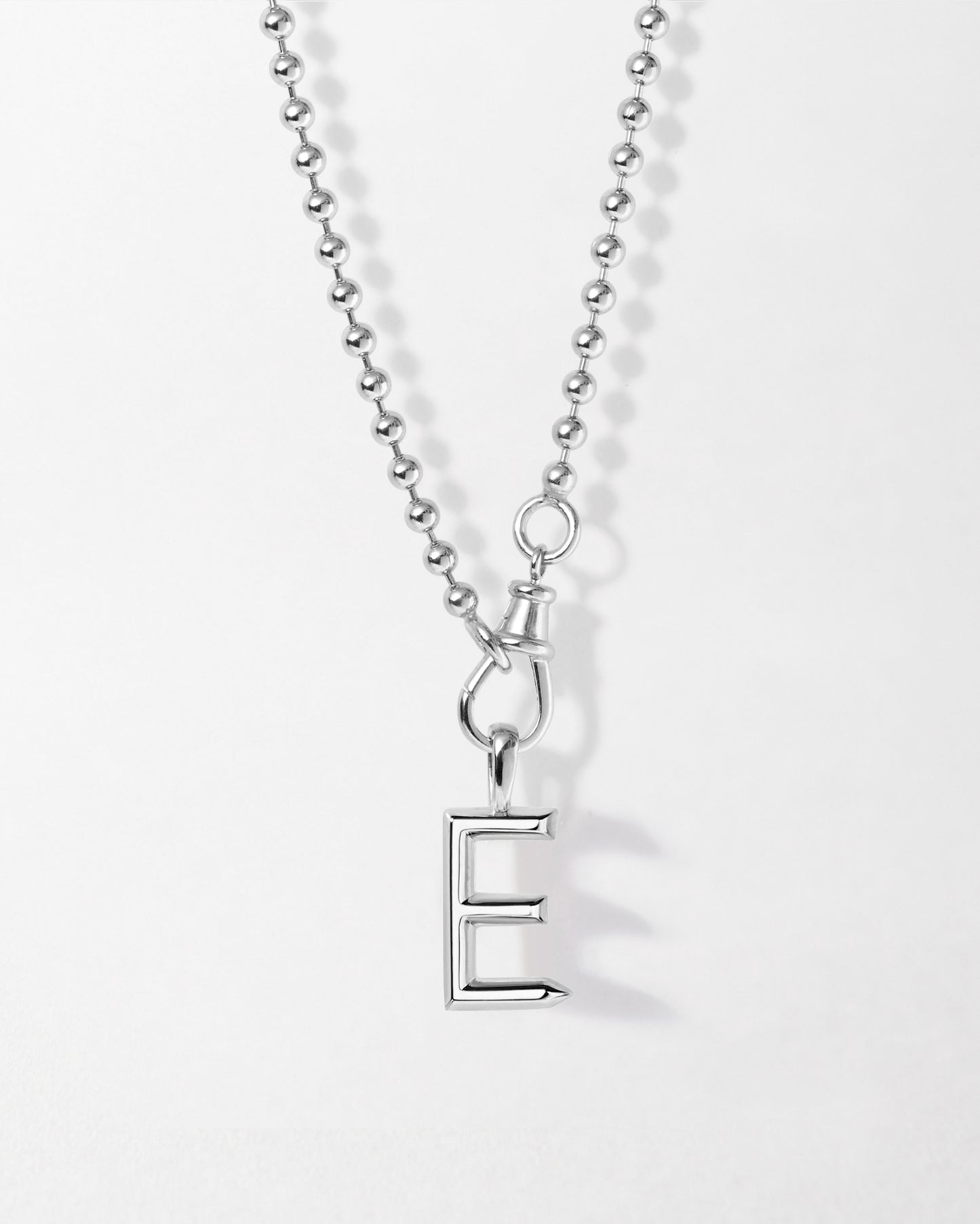 Initial Globe Necklace - Silver featuring a sterling silver pendant with the letter E on a delicate chain, crafted from recycled metals for considered jewellery made to last.