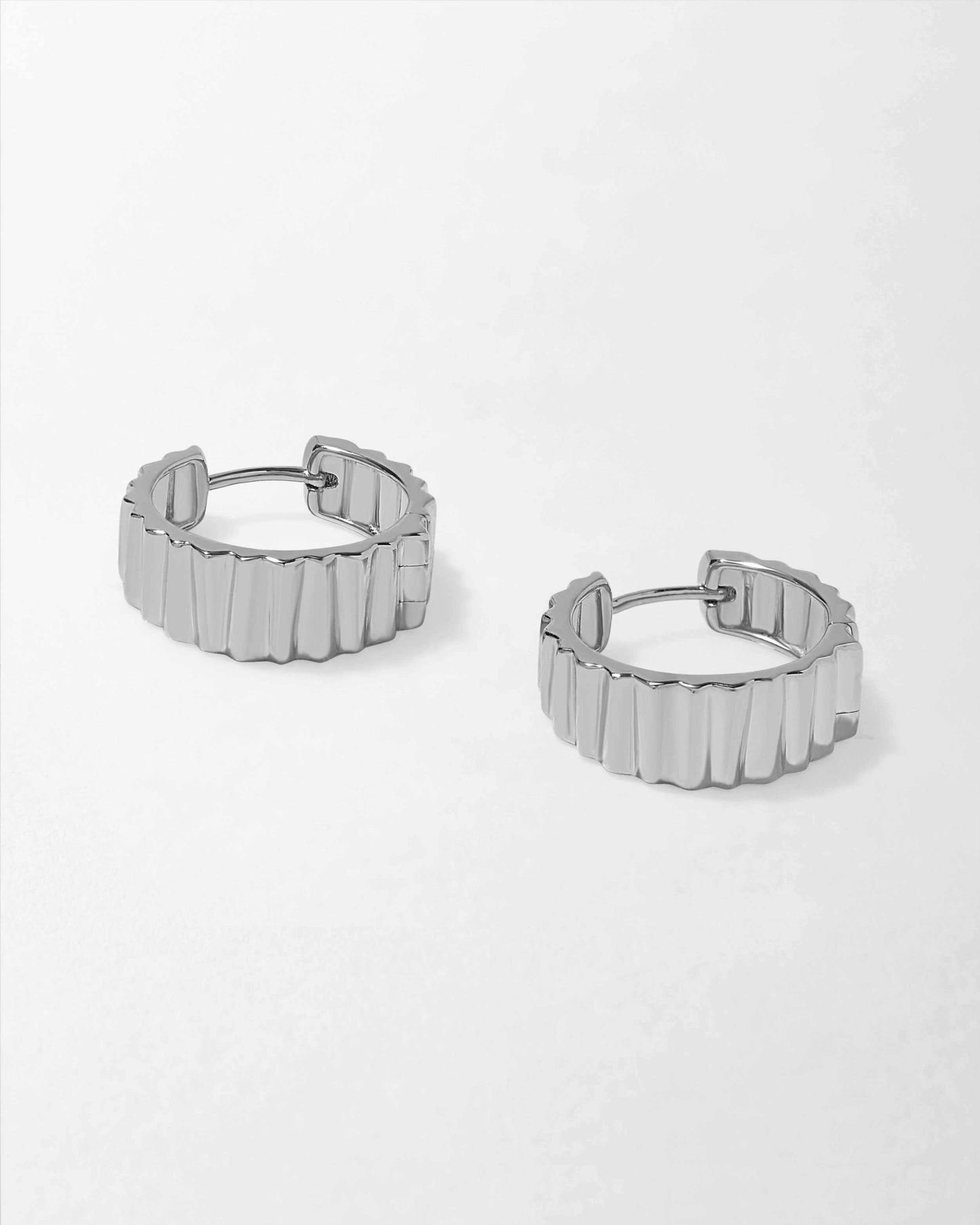 Flare Hoop Earrings - Silver crafted from sterling silver with a modern textured design, made from recycled metals for considered jewellery built to last.