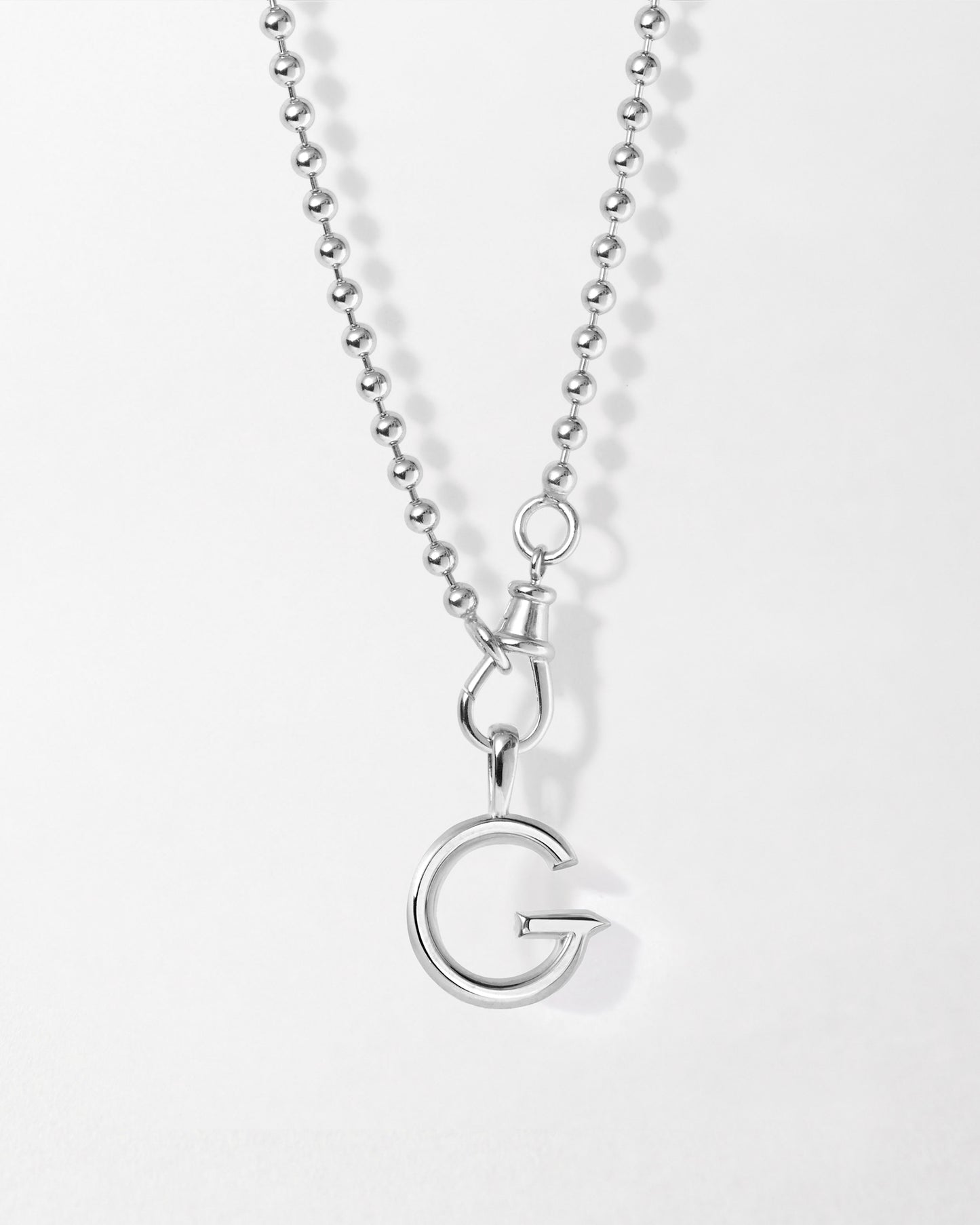 Initial Globe Necklace - Silver featuring a sterling silver pendant with a polished letter G on a ball chain, crafted with recycled metals for everyday fine jewellery that lasts.