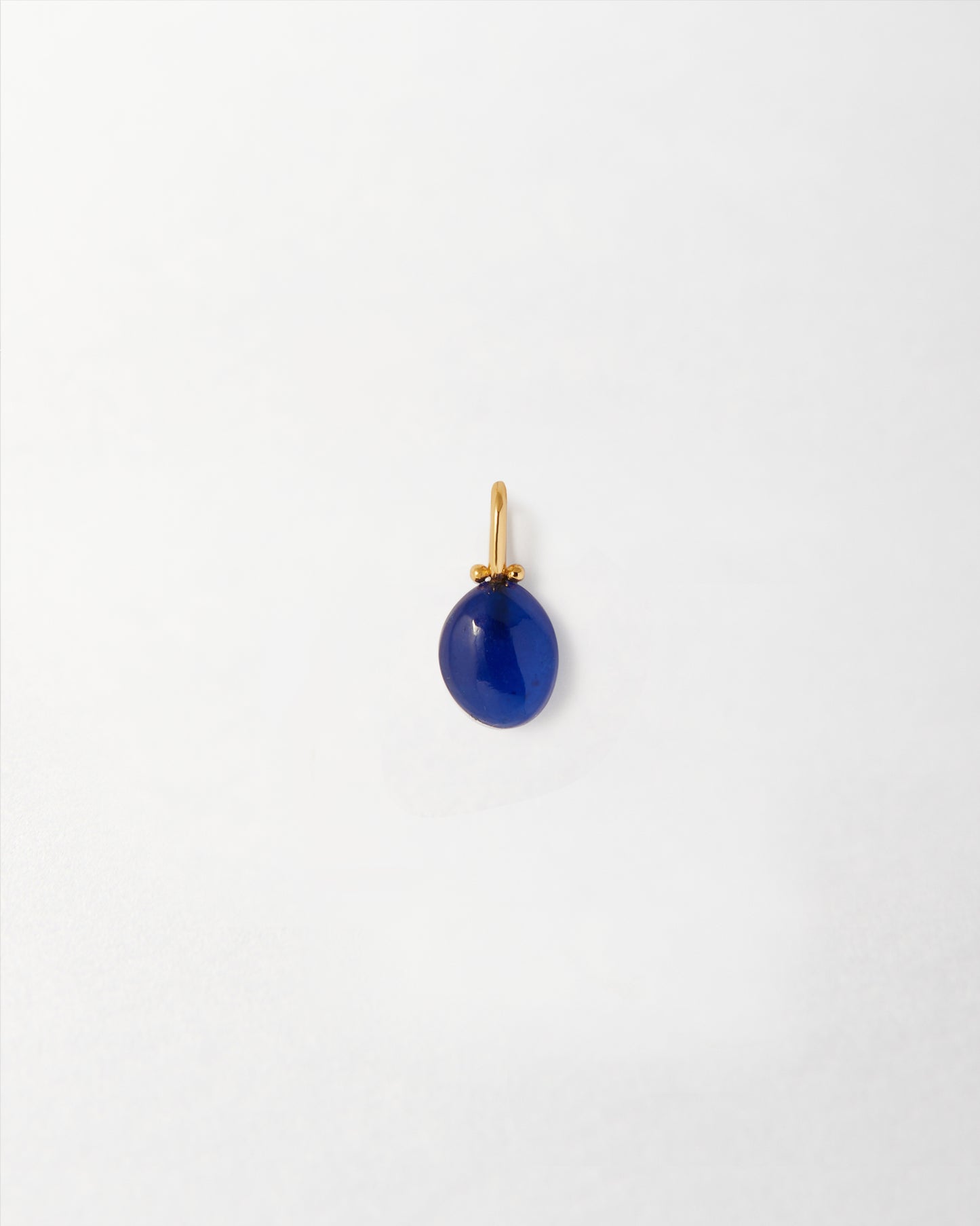 Coastal Blue Quartz Pendant featuring a deep blue quartz gemstone set in gold-plated sterling silver, crafted with recycled metals and ethical sourcing for everyday fine jewellery.