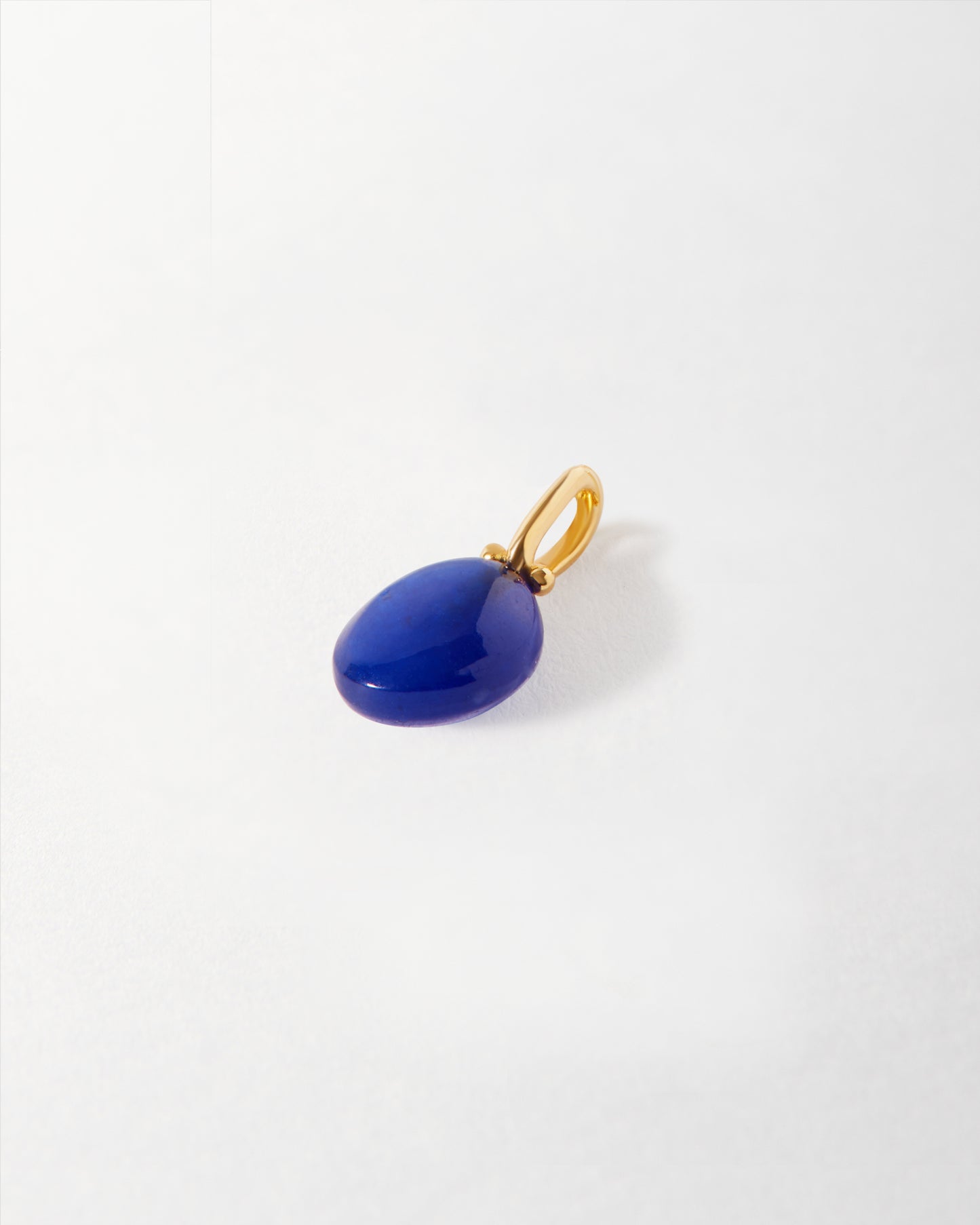 Coastal Blue Quartz Pendant featuring a deep blue quartz gemstone set in gold-plated and sterling silver, crafted sustainably with recycled metals for everyday fine jewellery.