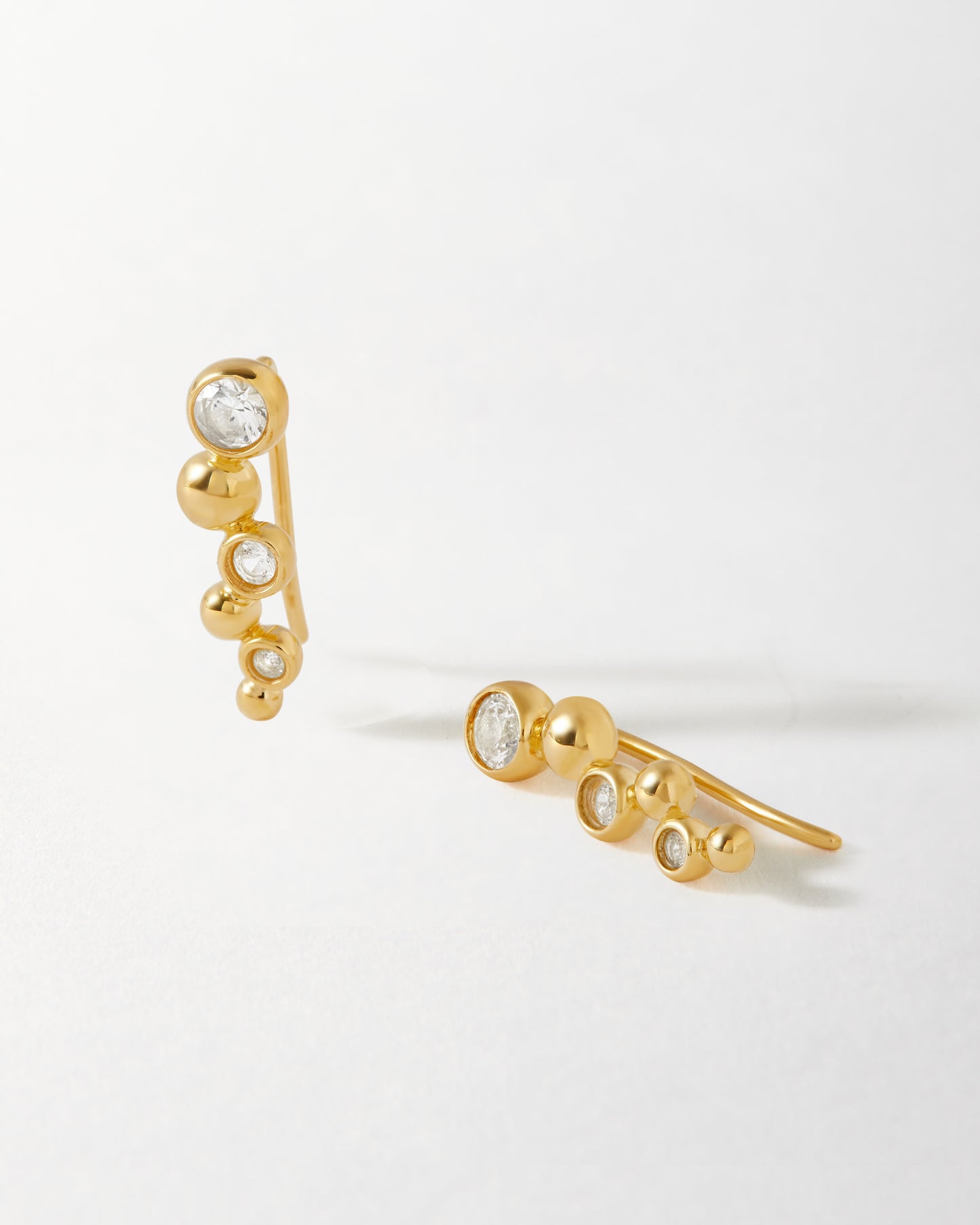 Globe White Sapphire Ear Crawler