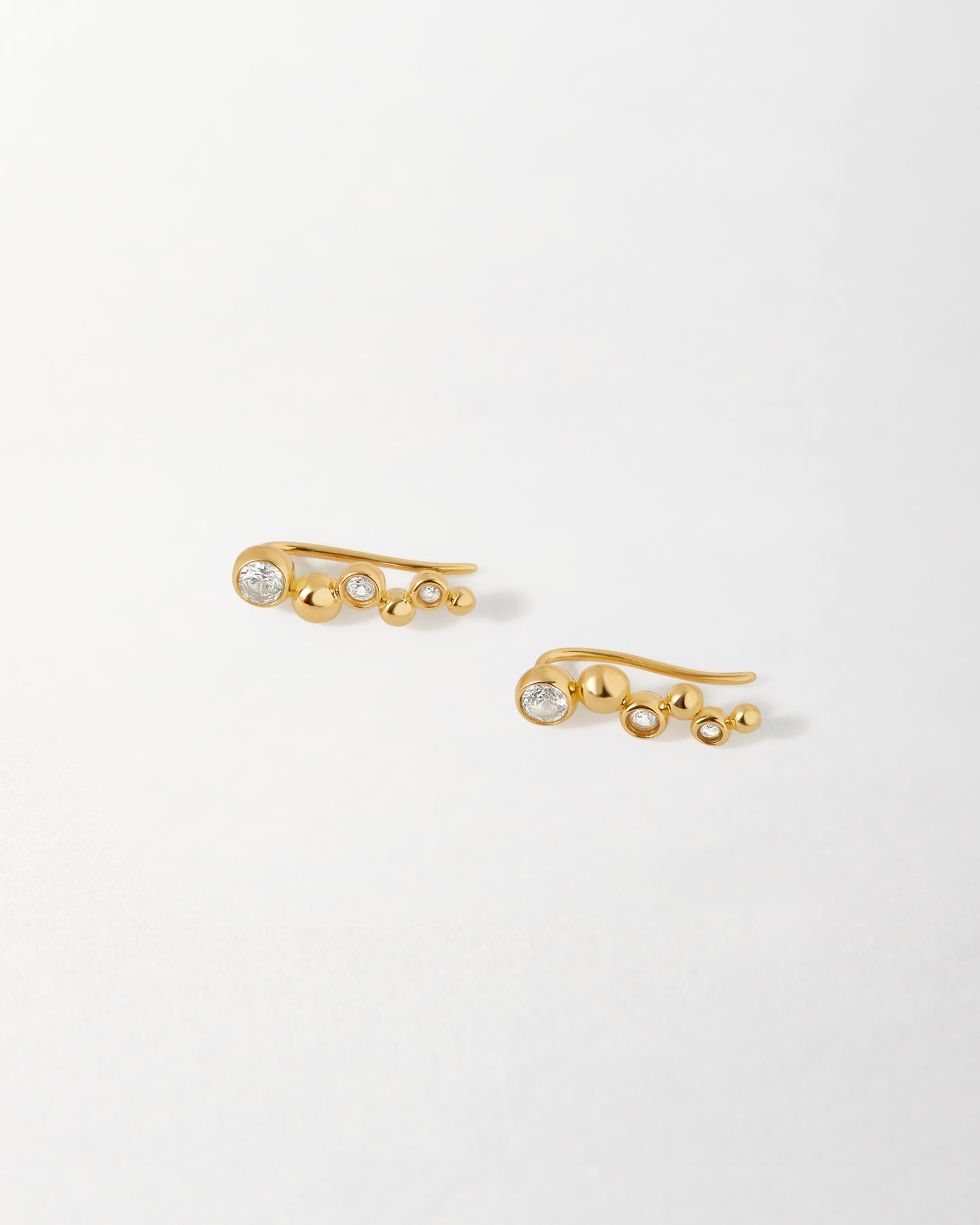 Globe White Sapphire Ear Crawler