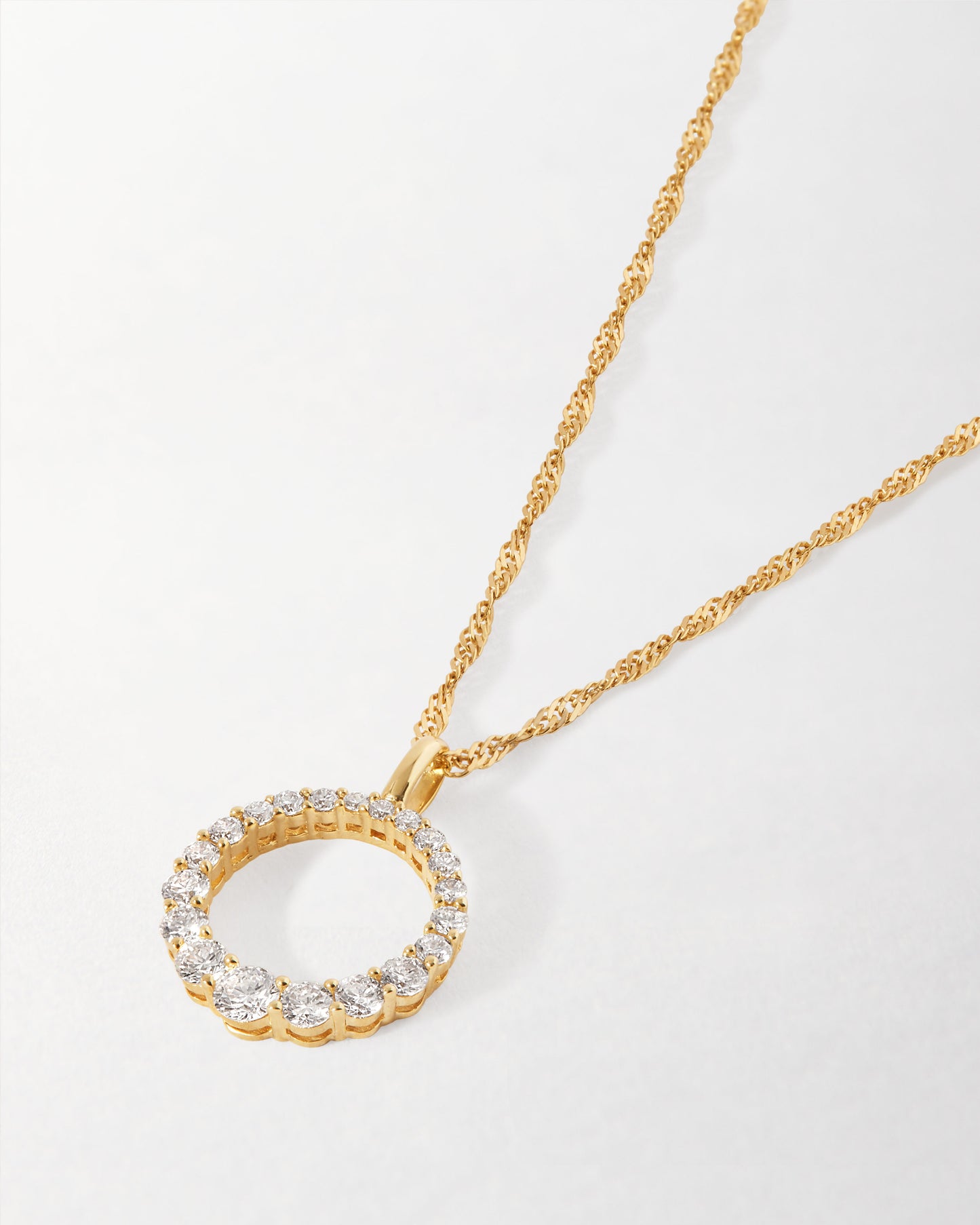 Diamond Halo Necklace featuring a pendant with lab-grown diamonds set in solid 14ct gold on a twisted gold chain, crafted from recycled metals with ethical sourcing.