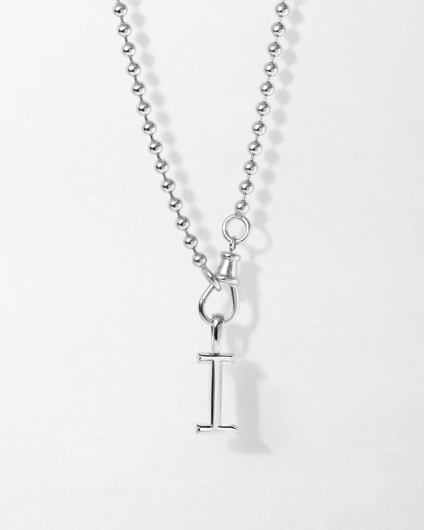 Initial Globe Necklace - Silver featuring a sterling silver chain with a pendant shaped as the letter I, crafted from recycled metals for sustainable fine jewellery made to last.