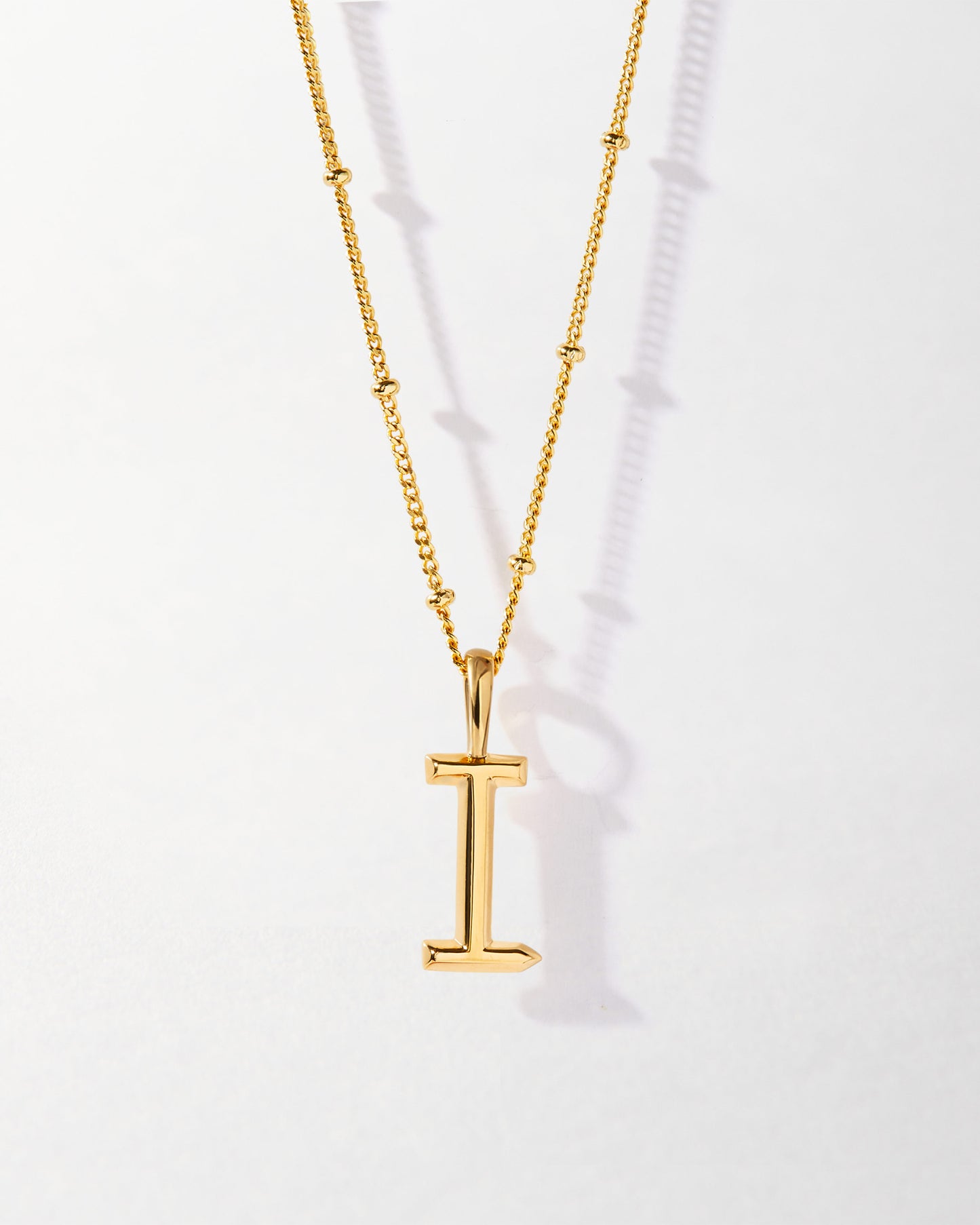 I' Initial Necklace - Gold featuring a sleek gold-plated pendant on a delicate chain, crafted from recycled metals for ethical, fine jewellery built to last.