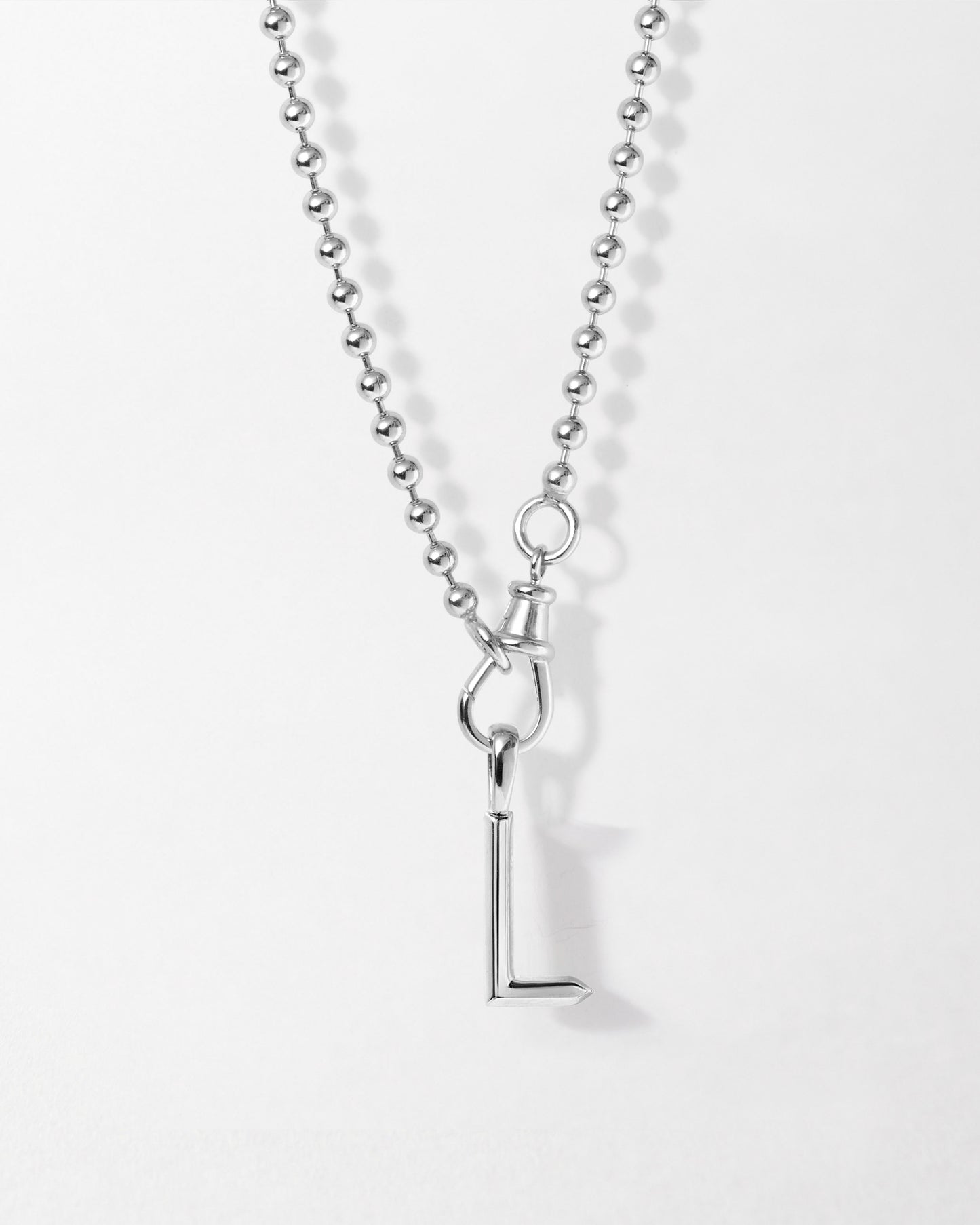 Initial Globe Necklace - Silver featuring a sterling silver pendant with a minimalist letter L design on a ball chain, crafted with recycled metals and ethical sourcing.
