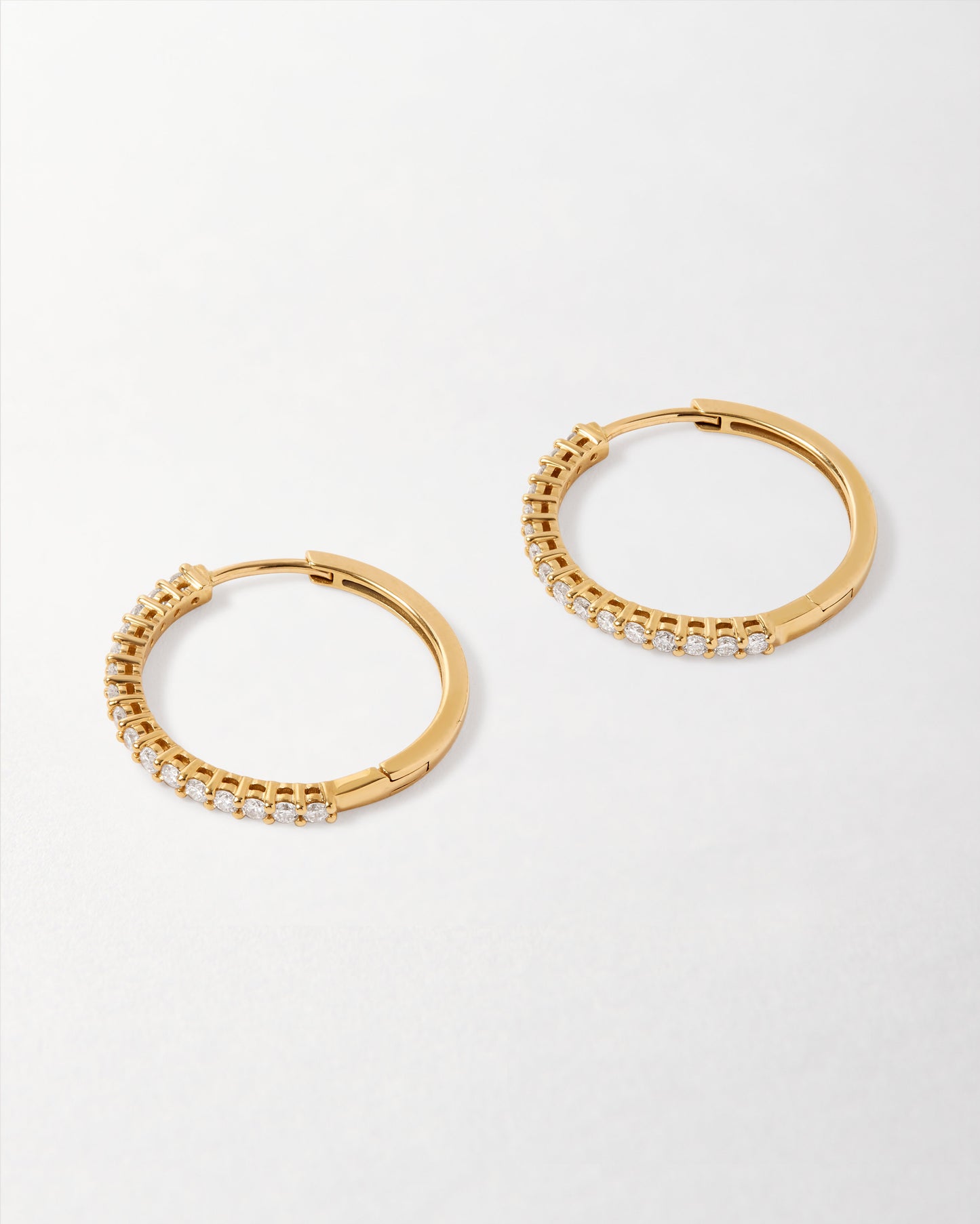 Large Diamond Halo Hoop Earrings crafted in solid gold with a row of sparkling diamonds, showcasing sustainable luxury and ethical sourcing for everyday fine jewellery.