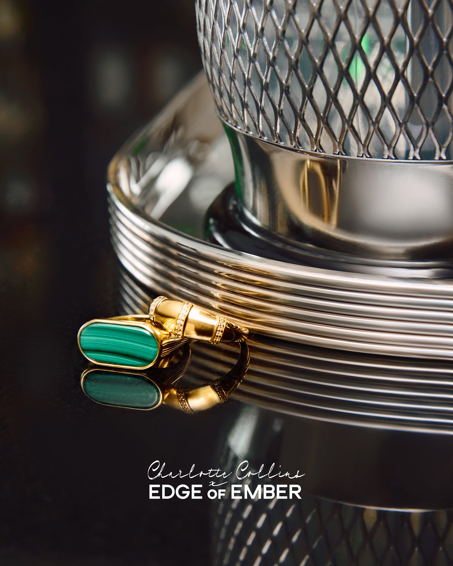 Charlotte Collins Dome Triple Pavé Hoop Ring in gold-plated sterling silver, showcased with a reflective green stone detail against a polished metallic background.