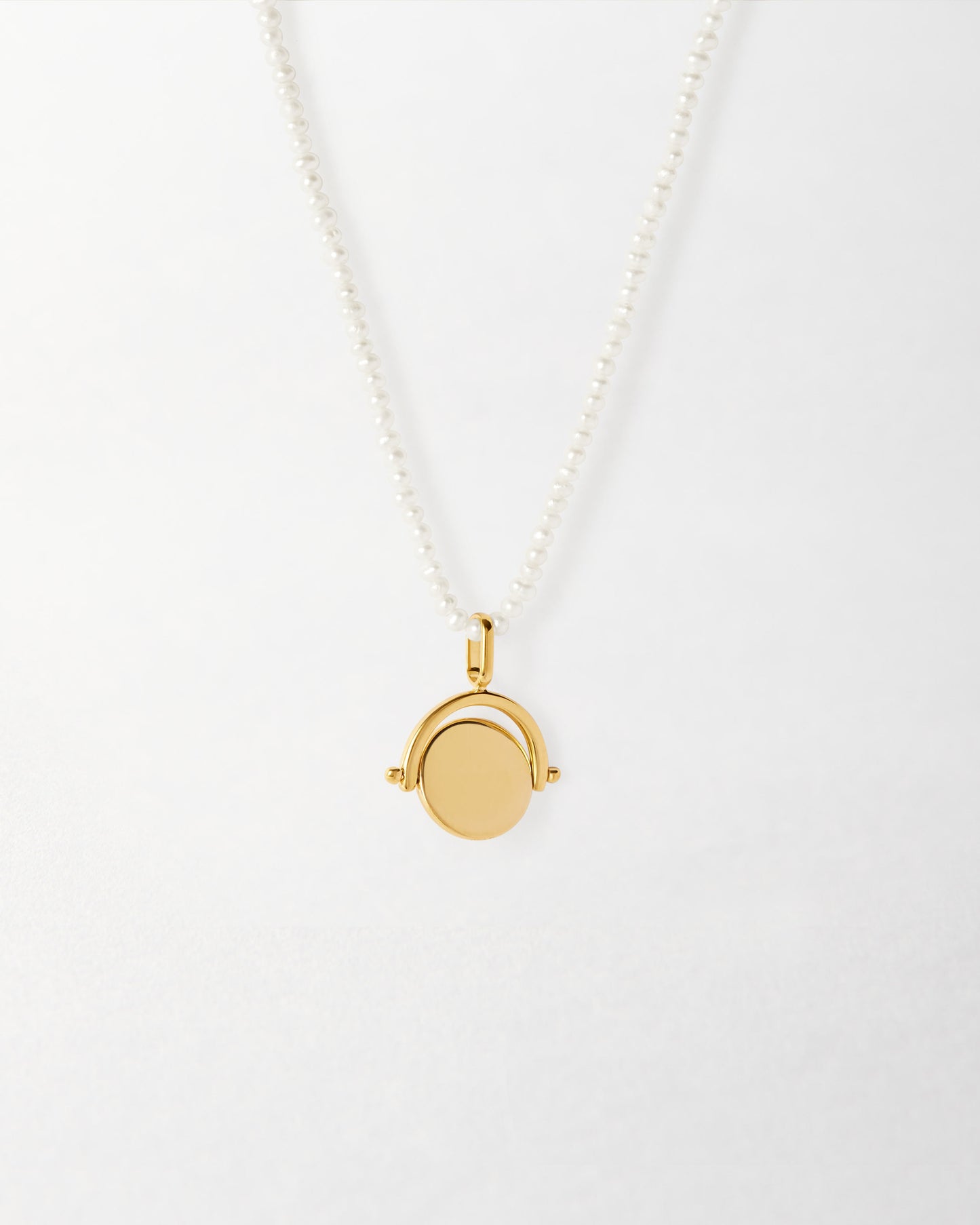 Mini Spinner Pearl Necklace featuring a gold-plated pendant on a sterling silver chain with pearls, crafted from recycled metals and designed as considered jewellery built to last.