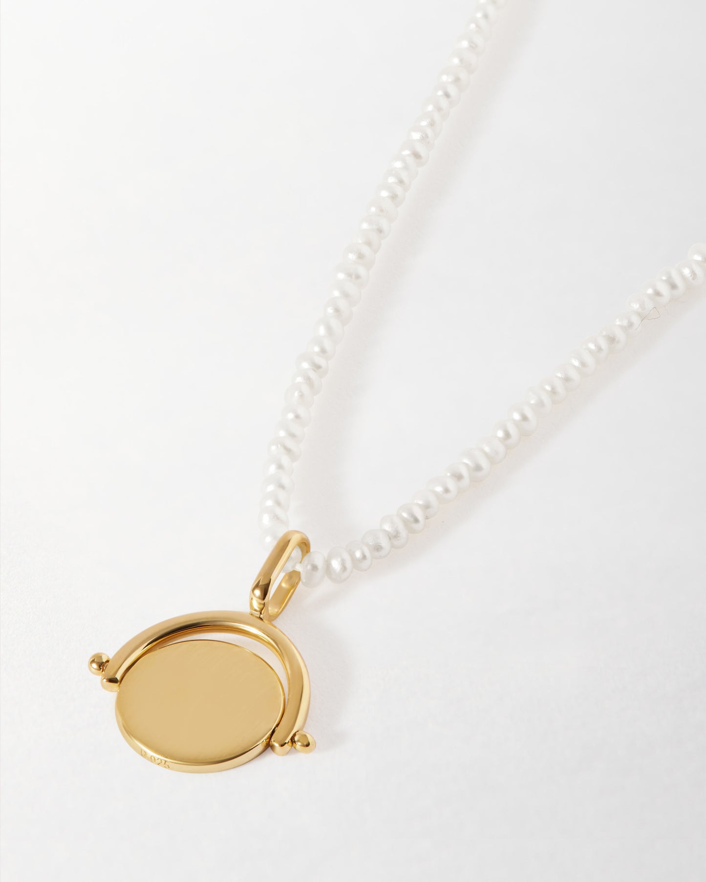 Mini Spinner Pearl Necklace featuring a gold-plated pendant on a delicate sterling silver pearl chain, crafted with recycled metals and ethical sourcing for everyday fine jewellery.