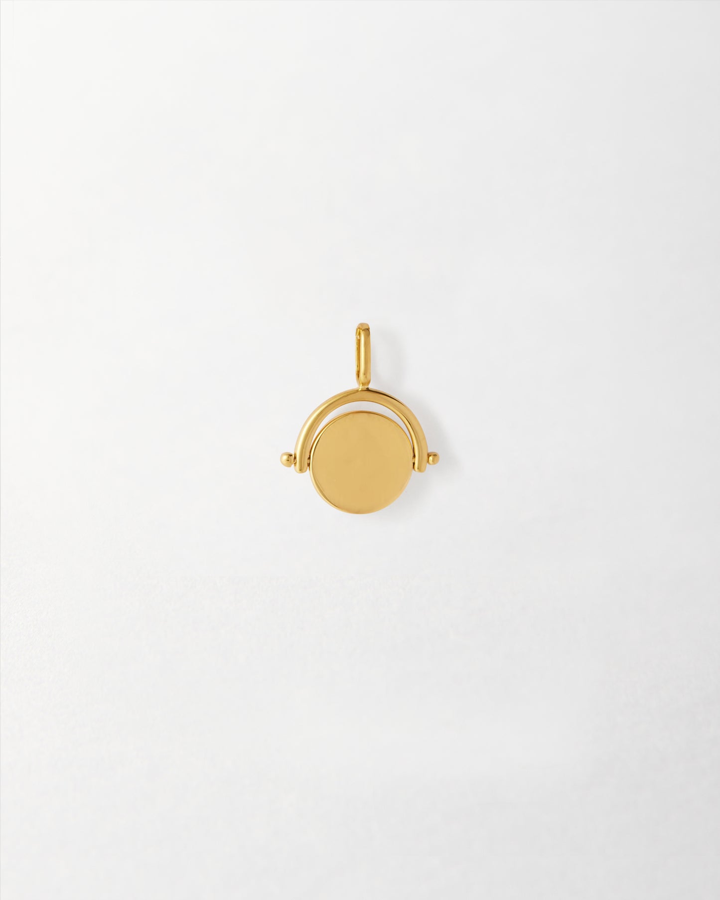 Mini Spinner Pendant in gold-plated sterling silver, crafted from recycled metals with ethical sourcing, offering considered fine jewellery designed to last.