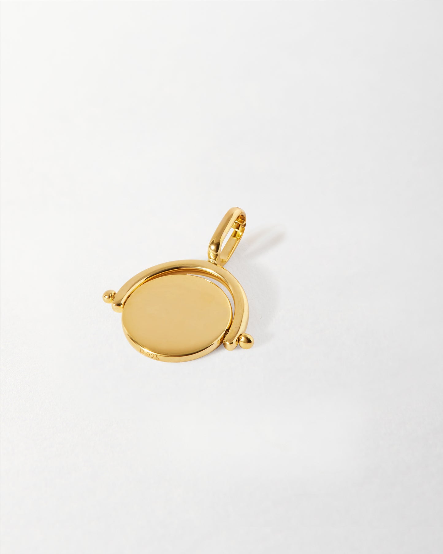 Mini Spinner Pendant in gold-plated recycled metals, showcasing fine craftsmanship and ethical sourcing, a perfect everyday solid gold-inspired accessory.