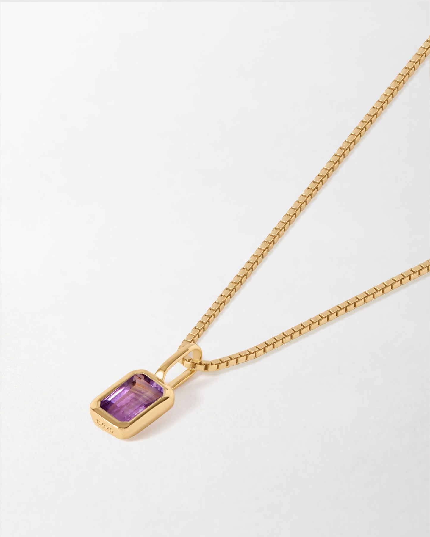Mini Deco Amethyst February Birthstone Necklace featuring a gold-plated pendant with a purple amethyst on a stylish gold chain, crafted from recycled metals and ethically sourced.