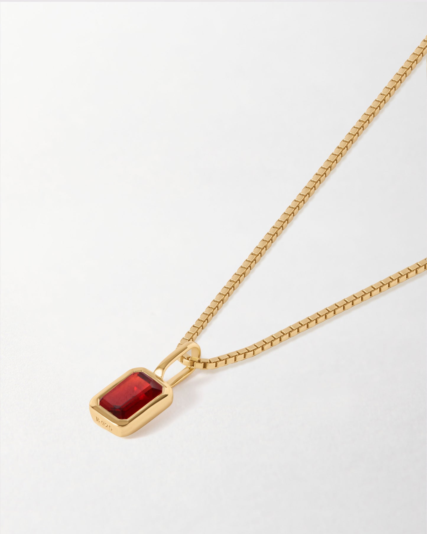 Mini Deco Garnet January Birthstone Necklace featuring a gold-plated pendant and chain, crafted with recycled metals and designed as fine jewellery for everyday wear.