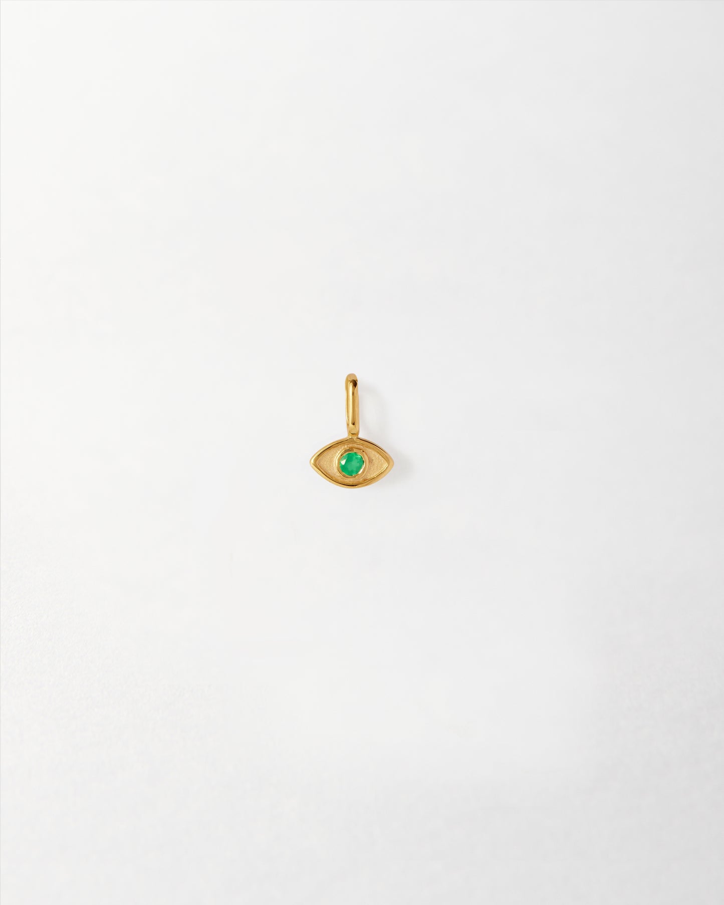 Mini Evil Eye Pendant crafted in solid gold featuring a green gemstone center, made from recycled metals with ethical sourcing and built to last.