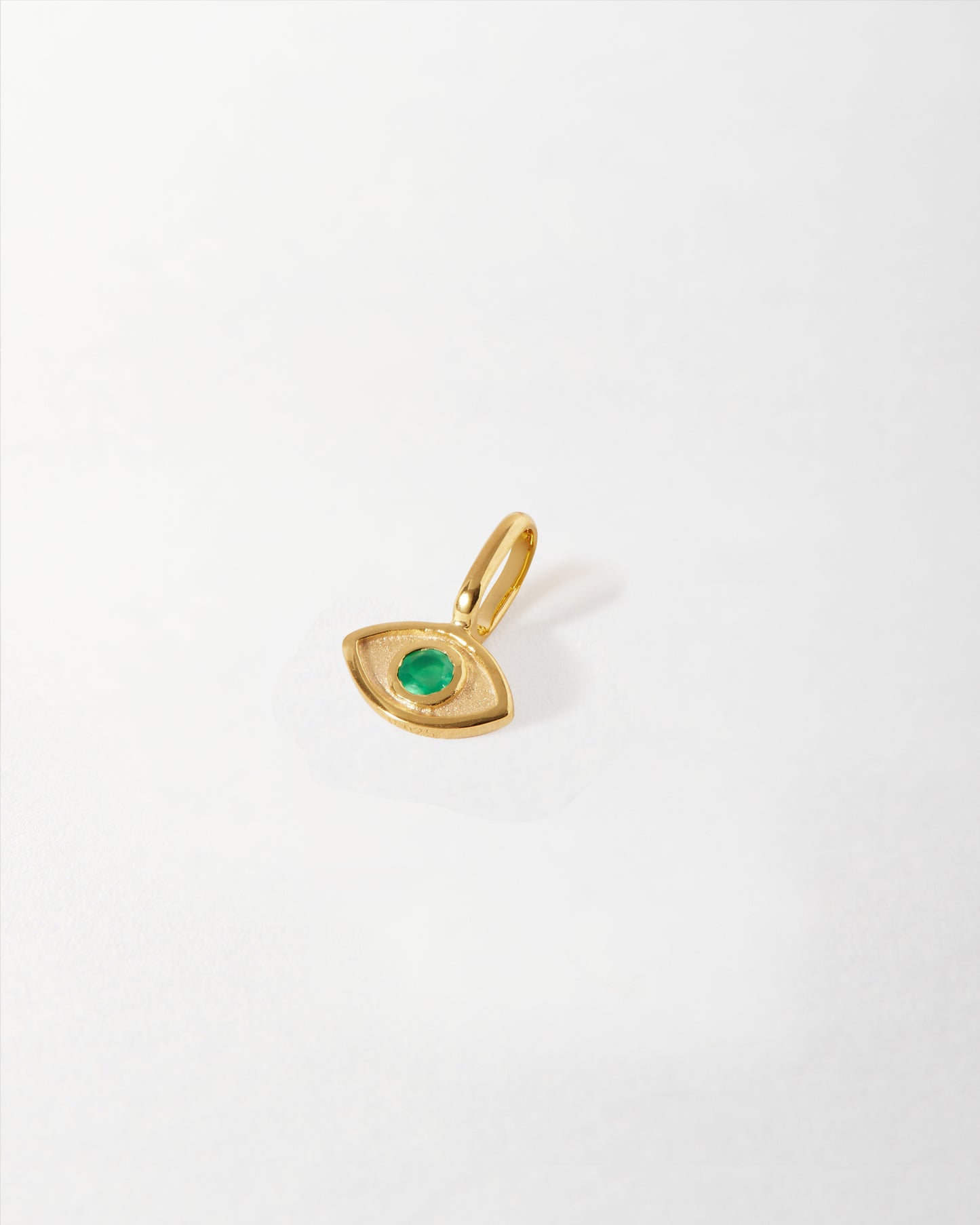 Mini Evil Eye Pendant crafted in solid 14ct gold with a green gemstone center, made from recycled metals and ethically sourced for everyday fine jewellery.