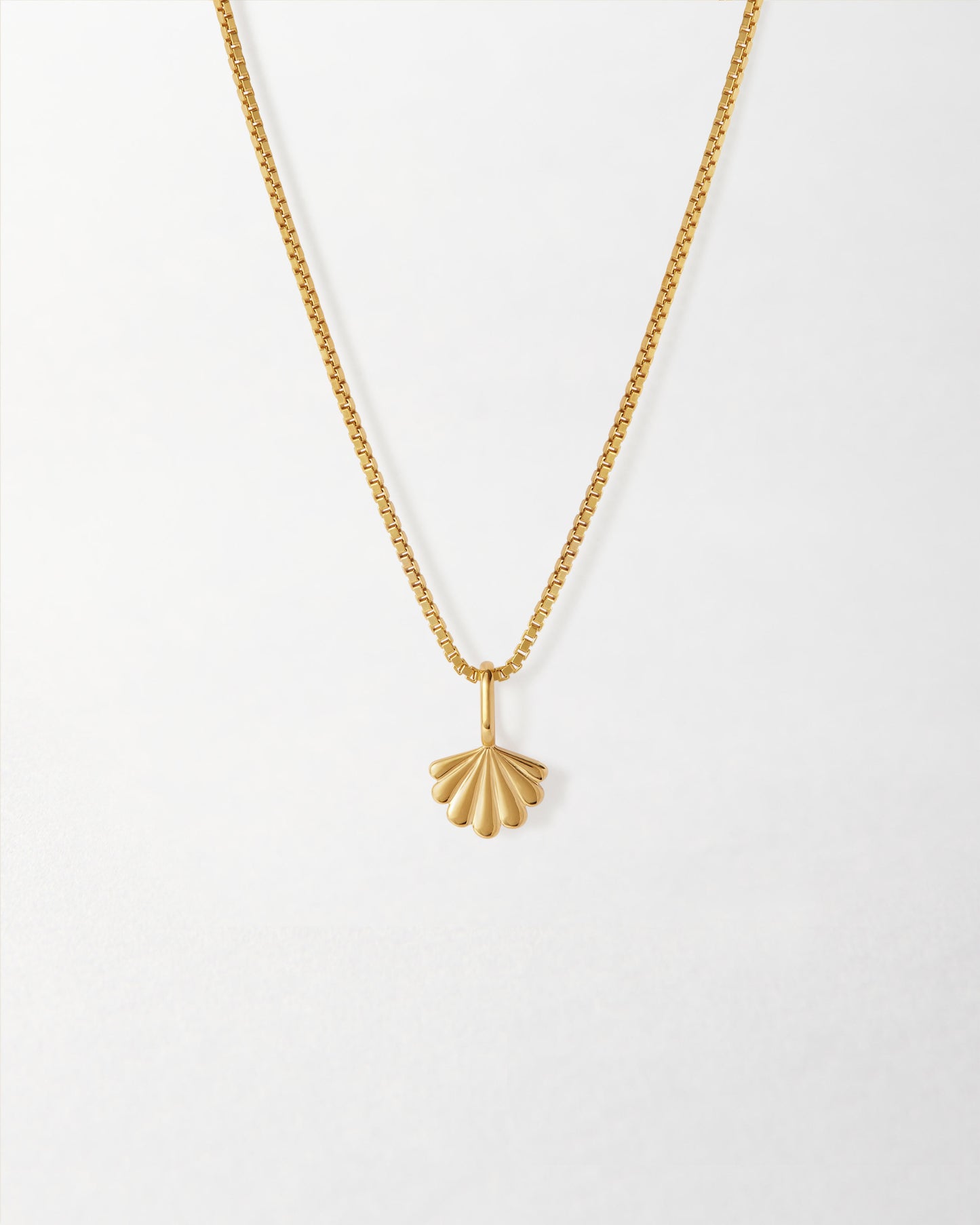 Mini Shell Necklace featuring a gold-plated pendant and chain crafted from recycled metals, offering considered fine jewellery made to last with ethical sourcing.