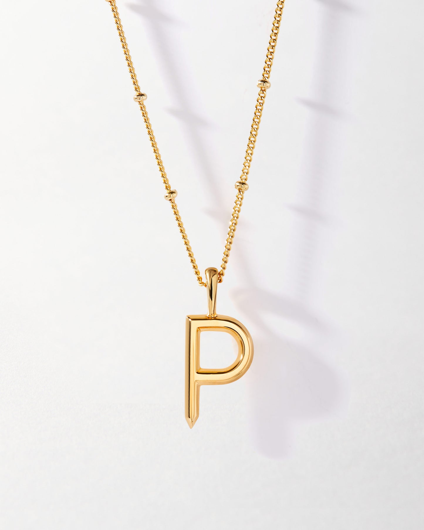 P' Initial Necklace - Gold featuring a gold-plated pendant with the letter P on a fine chain, crafted from recycled metals and designed as considered jewellery built to last.