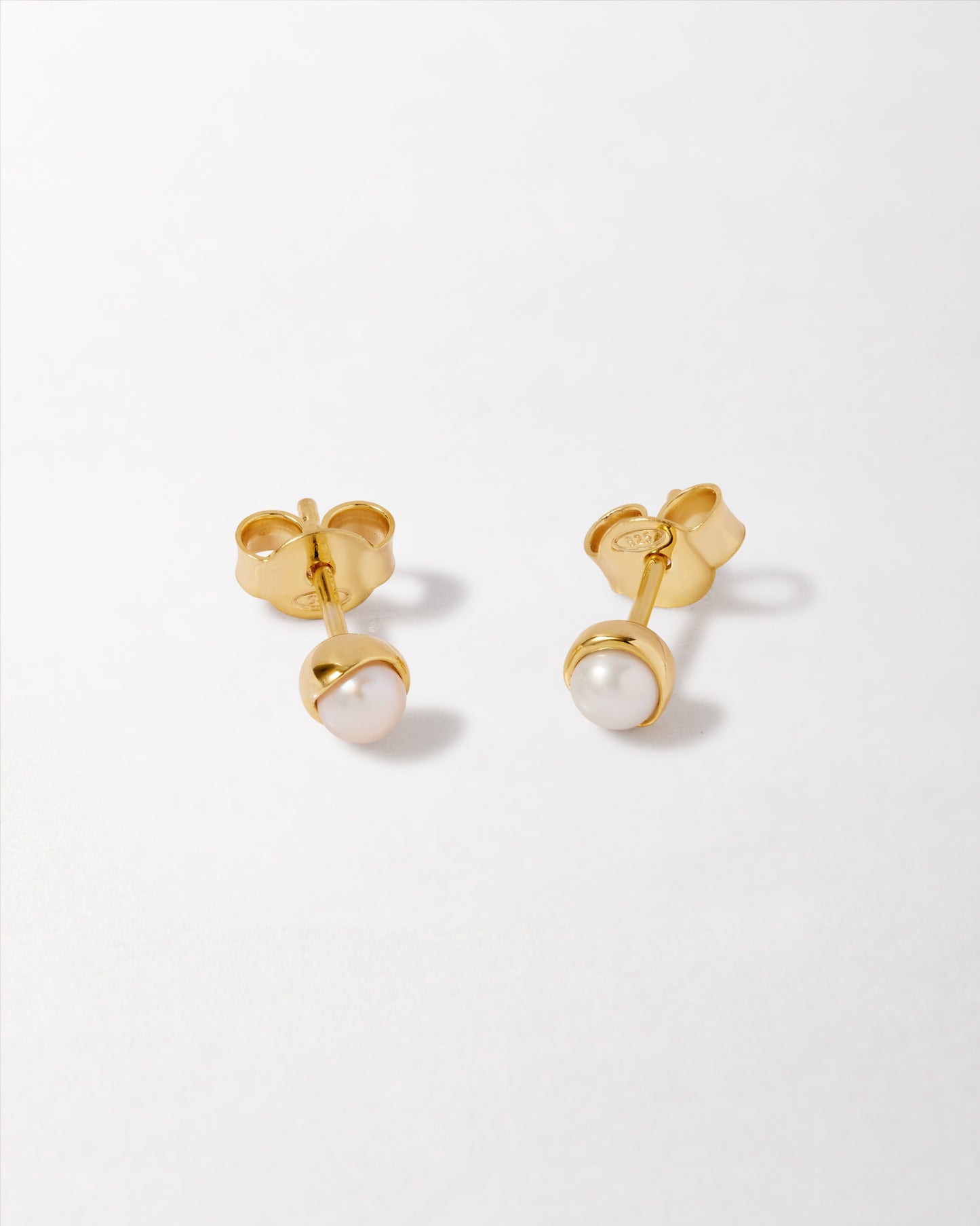 Pearl Stud Earring featuring a delicate pearl set in gold-plated sterling silver, crafted with recycled metals and ethical sourcing for everyday fine jewellery built to last.