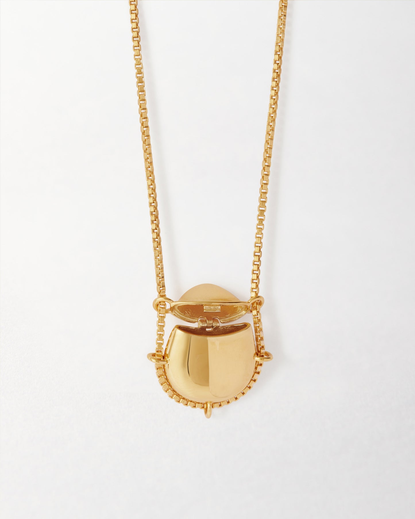 Secret Message Locket Necklace in gold-plated sterling silver, featuring a pendant with a hinged opening on a chain, crafted with recycled metals for considered, lasting fine jewellery.