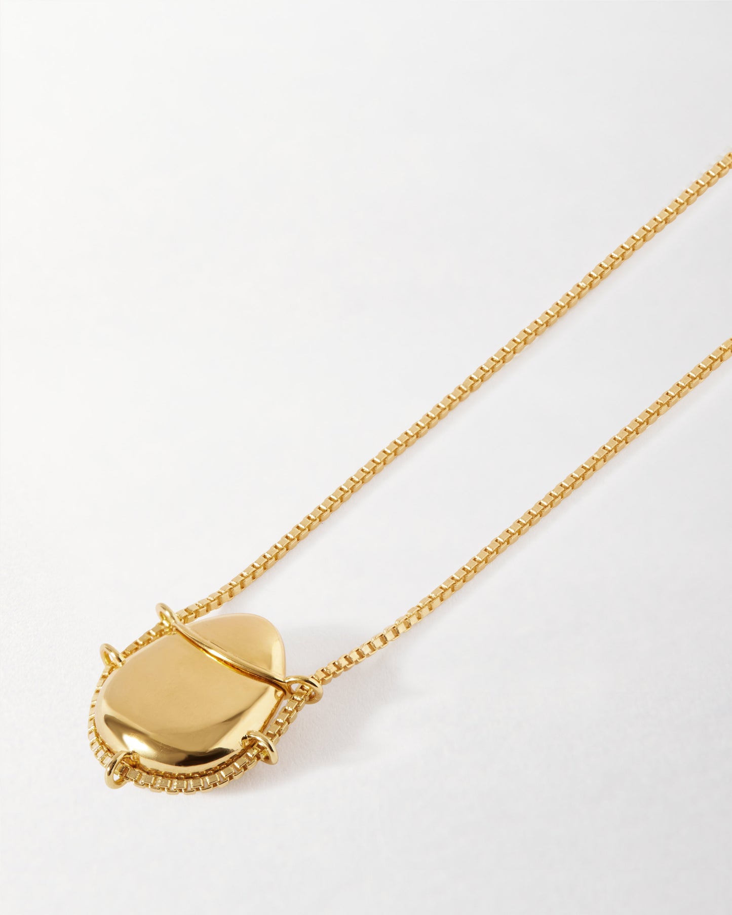 Secret Message Locket Necklace in gold-plated sterling silver with a delicate chain, crafted in recycled metals for ethical, considered fine jewellery made to last.