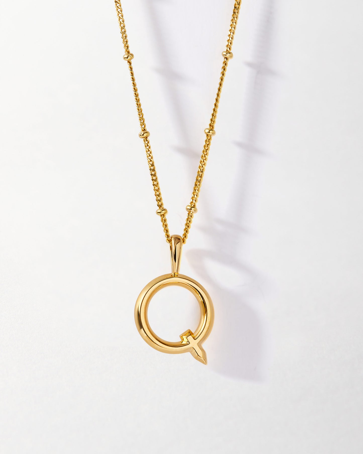 Q' Initial Necklace - Gold featuring a gold-plated pendant shaped as the letter Q on a delicate chain, crafted in recycled metals for everyday fine jewellery with ethical sourcing.