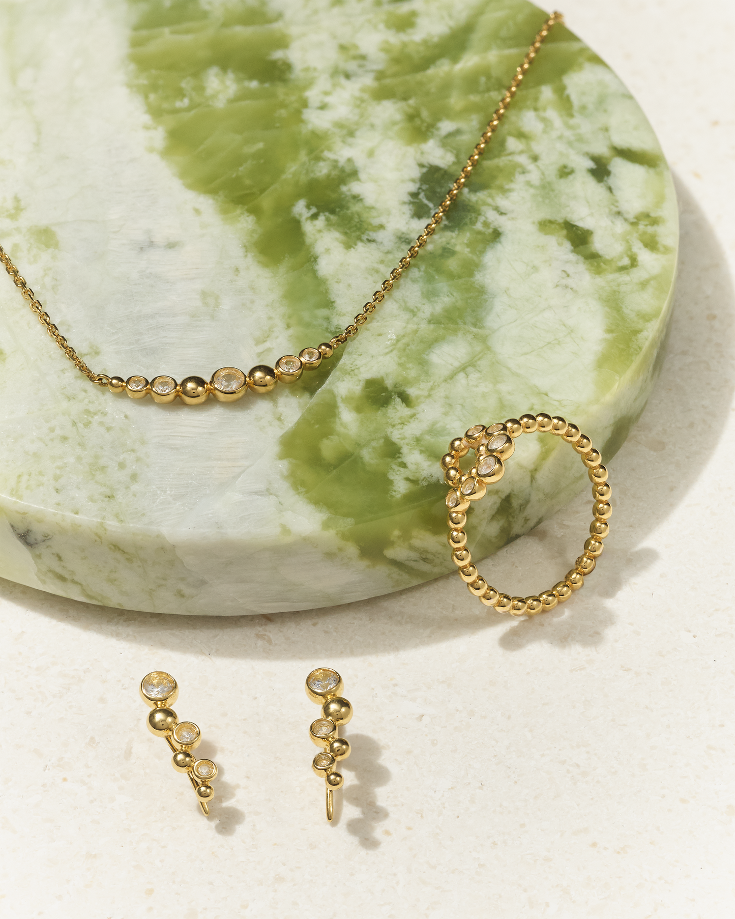 Globe White Sapphire Ear Crawler