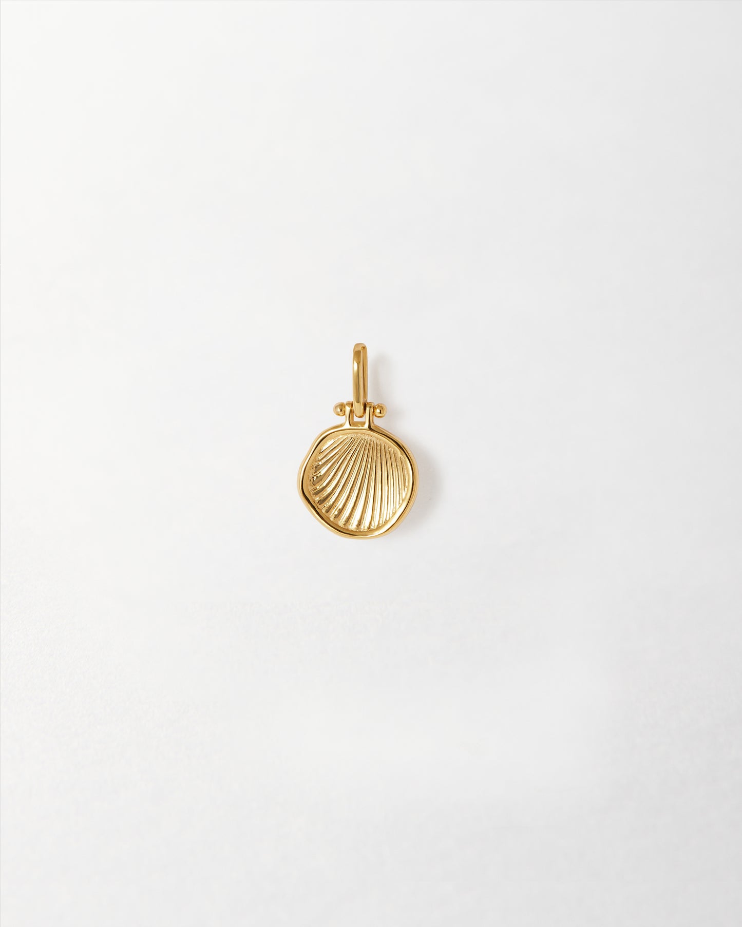 Coastal Shell Pendant in gold-plated sterling silver, crafted with recycled metals for considered jewellery that combines solid gold elegance with everyday fine style.