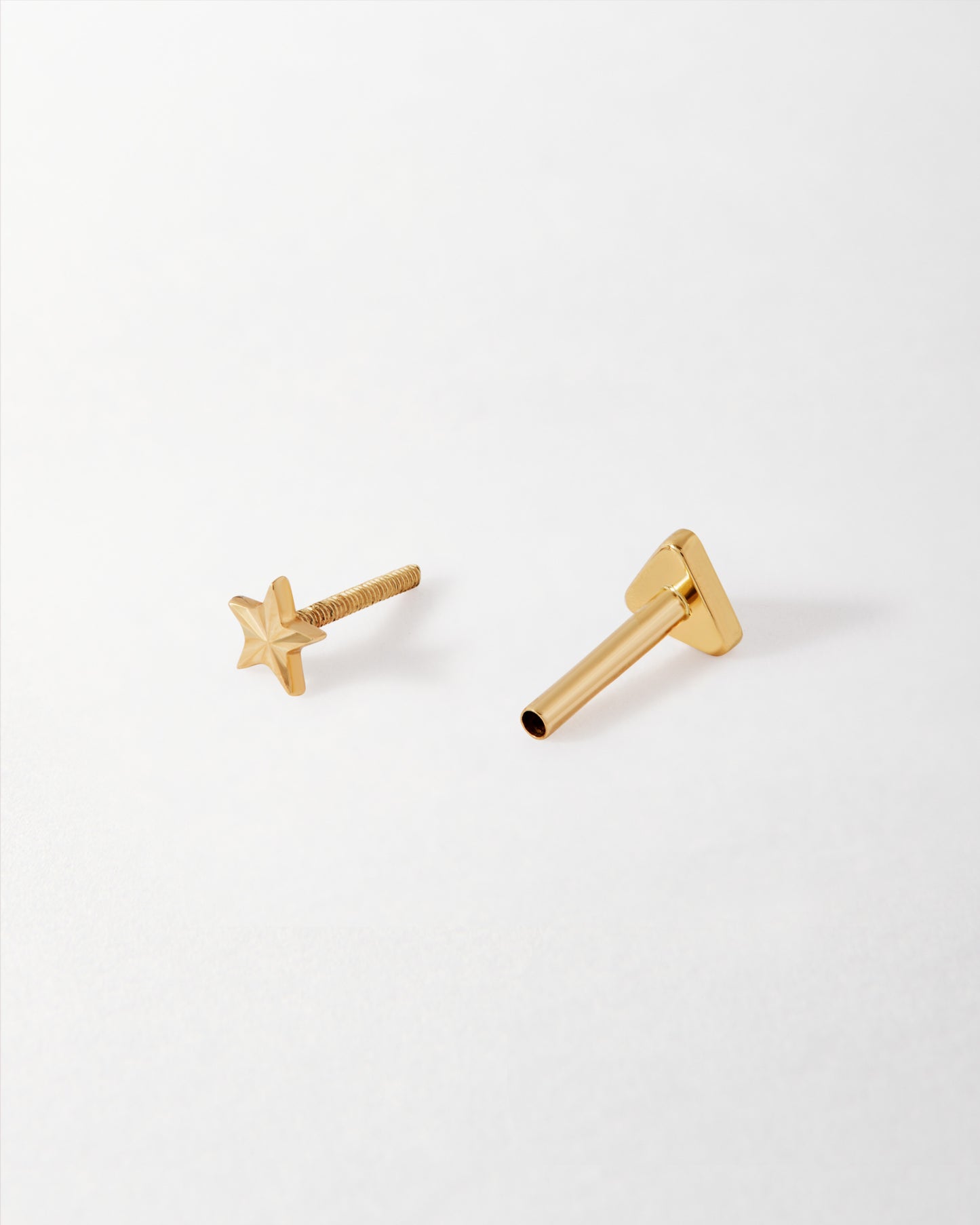 Solid Gold Star Piercing Earring featuring a delicate star-shaped stud crafted from solid 14ct gold, made with recycled metals for ethical, everyday fine jewellery.