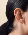 Close-up of an ear wearing a Solid Gold Lab-Grown Marquise Diamond Piercing Earring crafted in recycled metals with ethical sourcing, showcasing fine 14ct solid gold jewellery designed for everyday luxury.