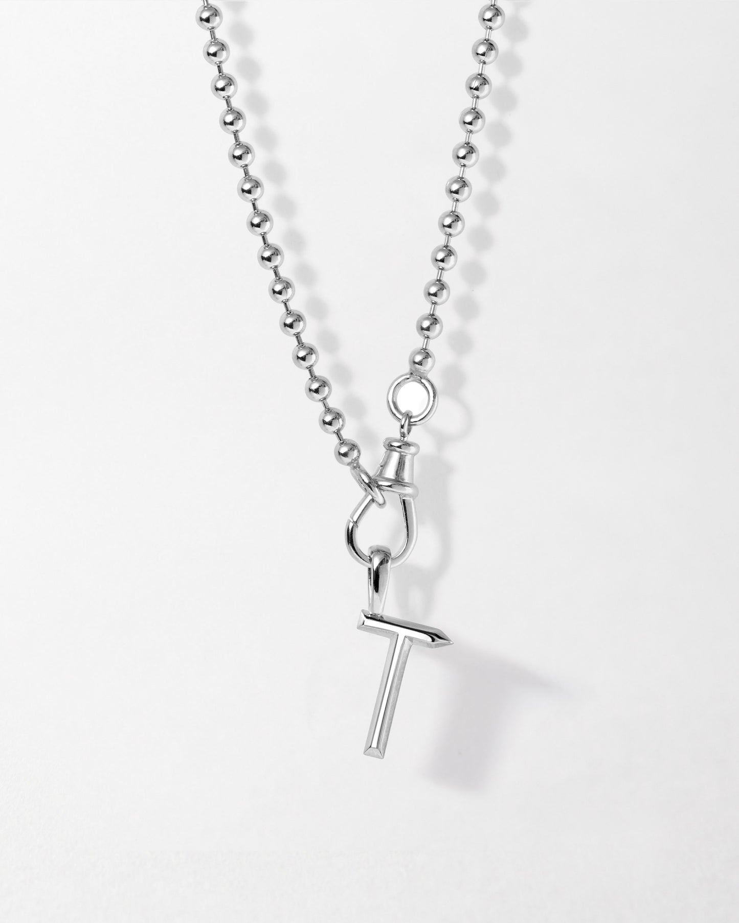 Initial Globe Necklace - Silver featuring a sterling silver pendant with a sleek letter T charm on a beaded chain, crafted from recycled metals with ethical sourcing.