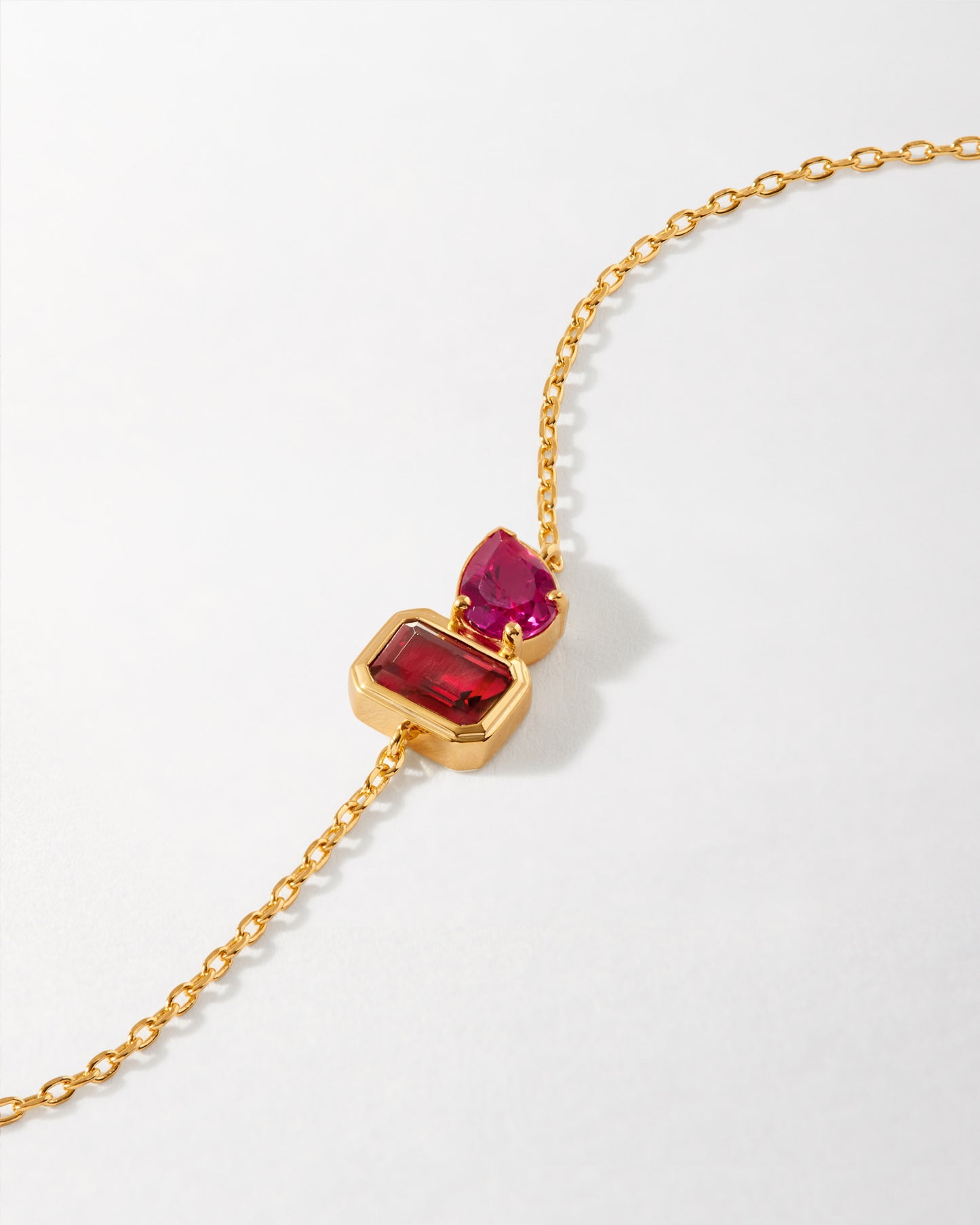 Toi Et Moi Courage Bracelet featuring two vibrant red stones set in solid 14ct recycled gold on a delicate chain, showcasing considered jewellery crafted to last.