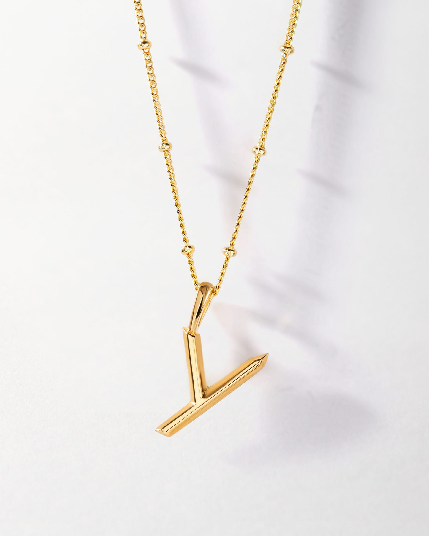 Y' Initial Necklace - Gold featuring a gold-plated pendant and chain crafted from recycled metals, designed as fine, considered jewellery made to last.